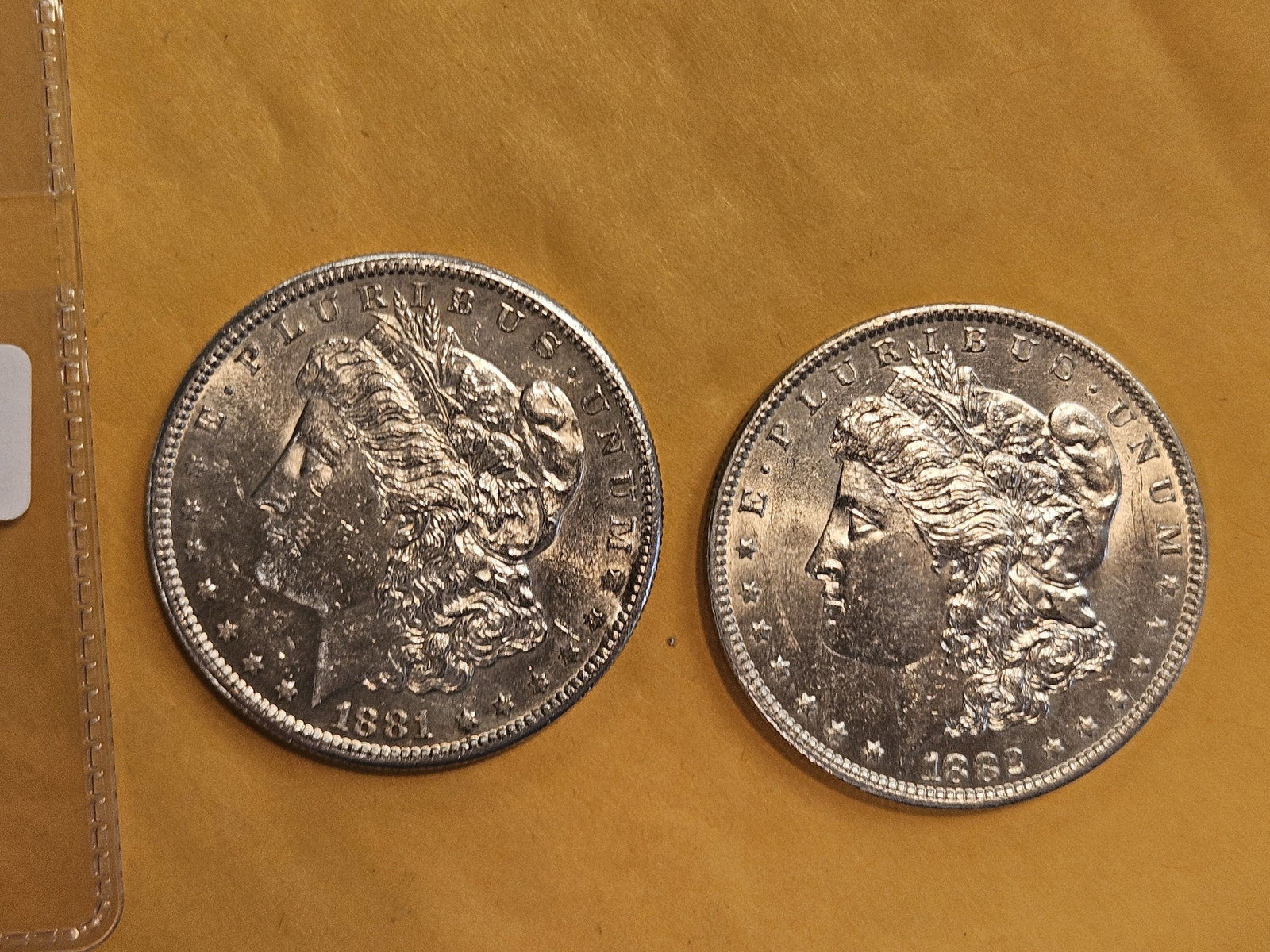 Two Brilliant About Uncirculated plus Morgan Silver Dollars: Mixed