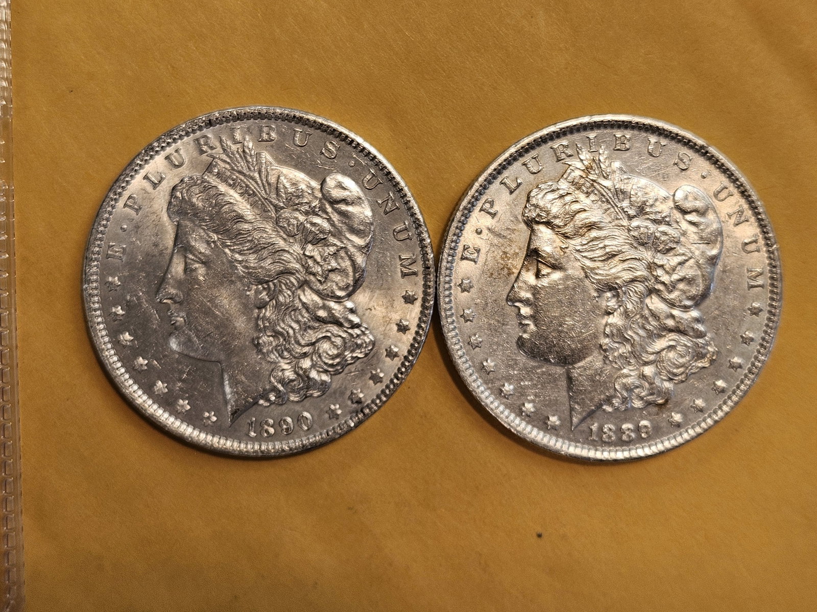 Two Brilliant About Uncirculated plus Morgan Silver Dollars: Mixed