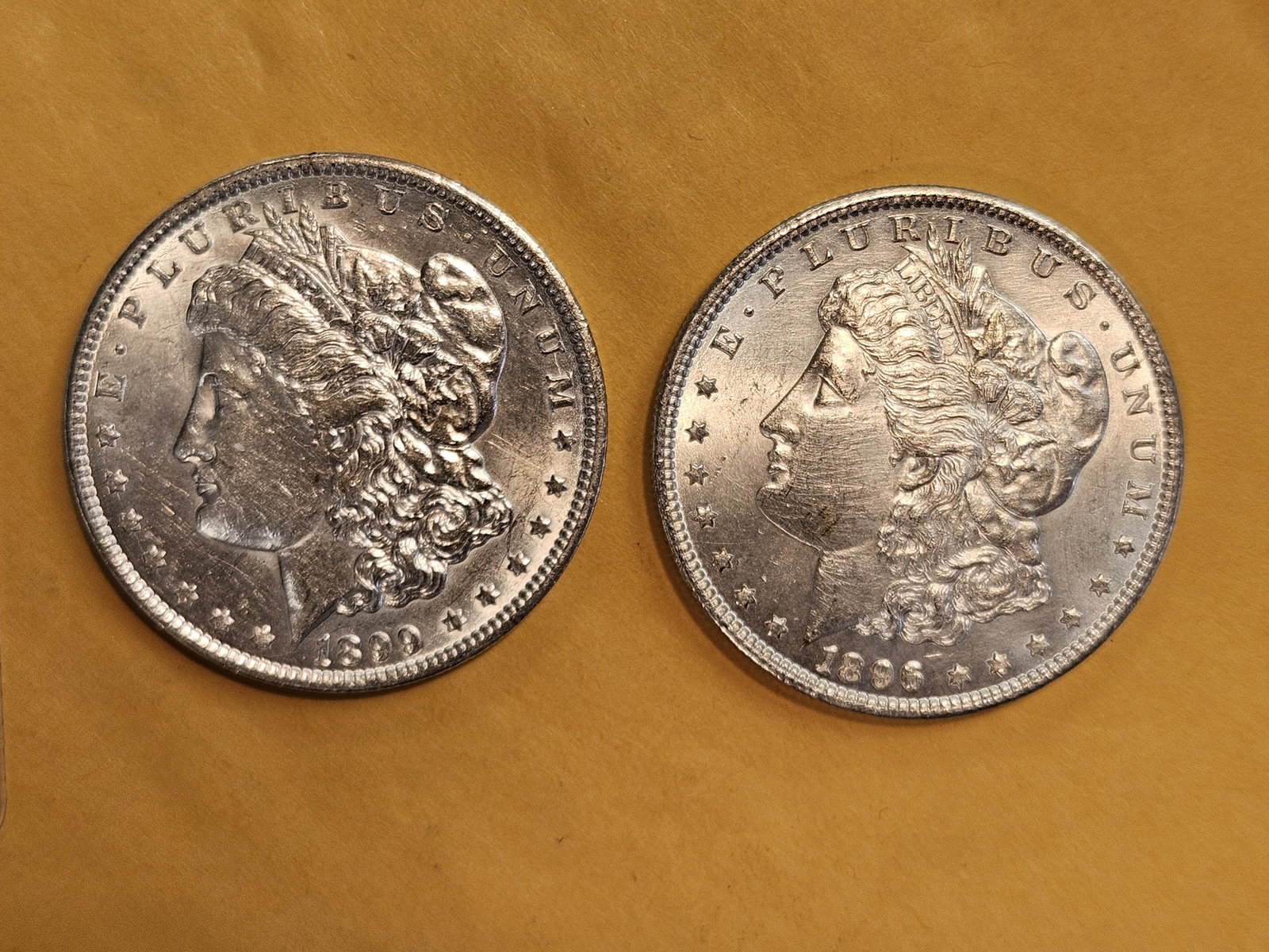 Two Brilliant About Uncirculated plus Morgan Silver Dollars: Mixed