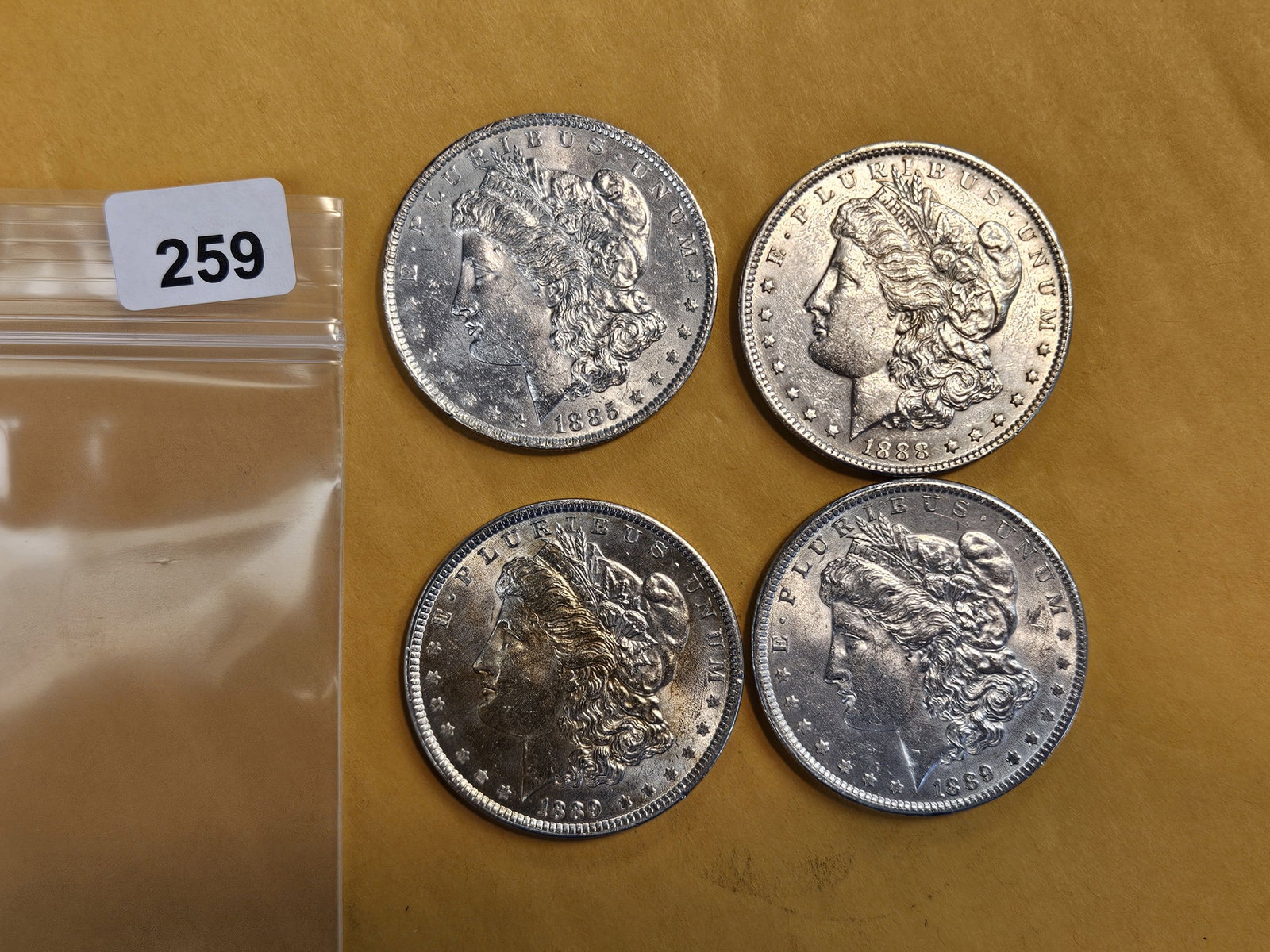 Four Bright About Uncirculated Morgan Dollars: Mixed