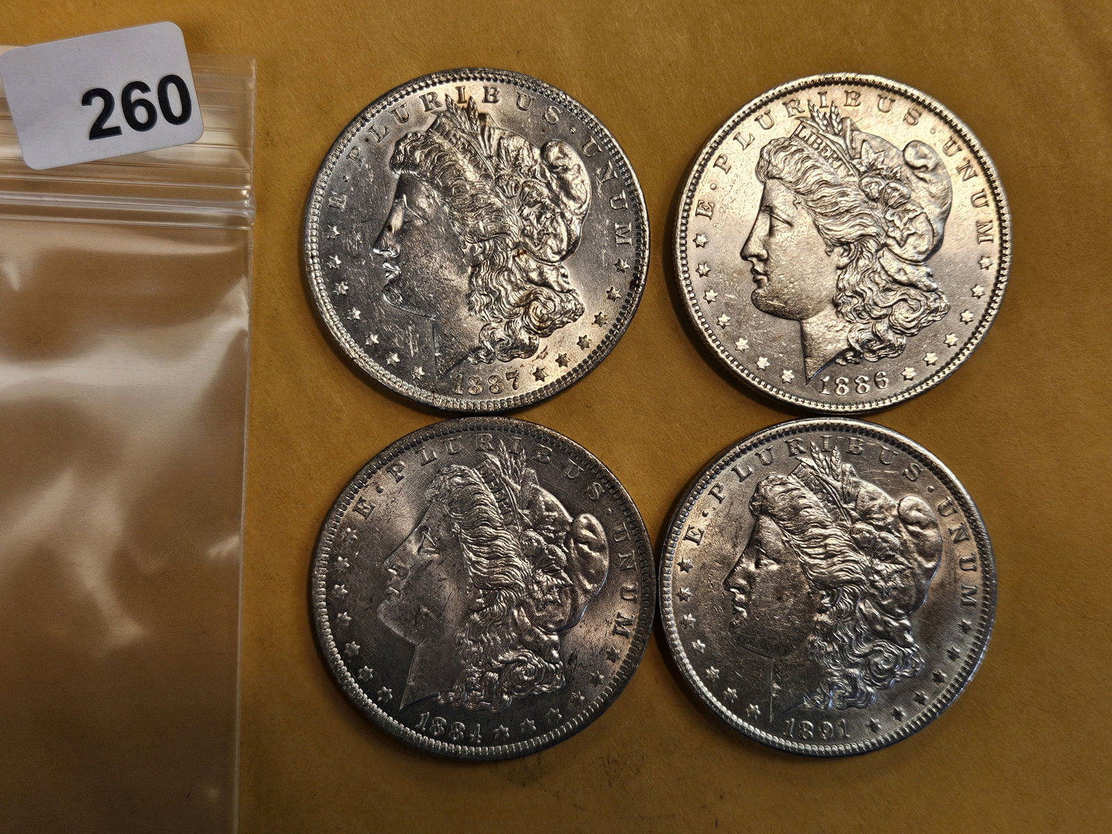 Four Bright About Uncirculated Morgan Dollars: Mixed
