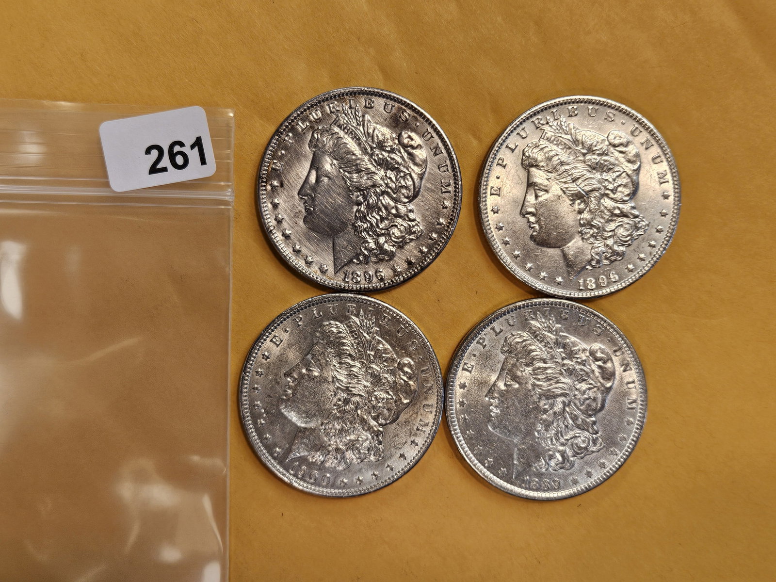 Four Bright About Uncirculated Morgan Dollars: Mixed