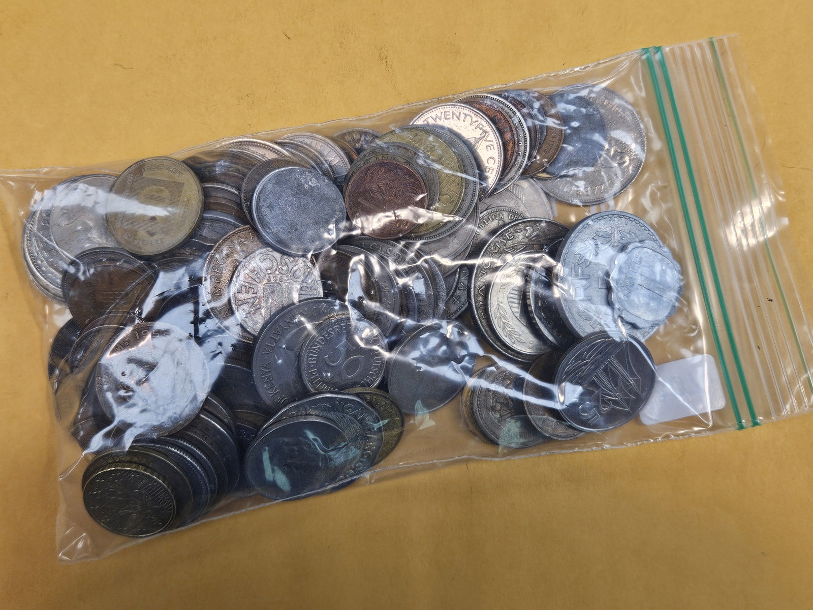 One and one-quarter pounds of mixed World Coins - 2