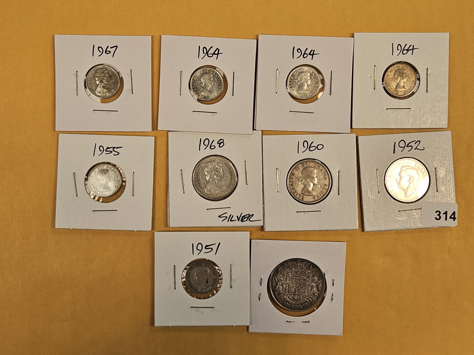 Ten mixed, silver, Canadian coins (1 of 3)