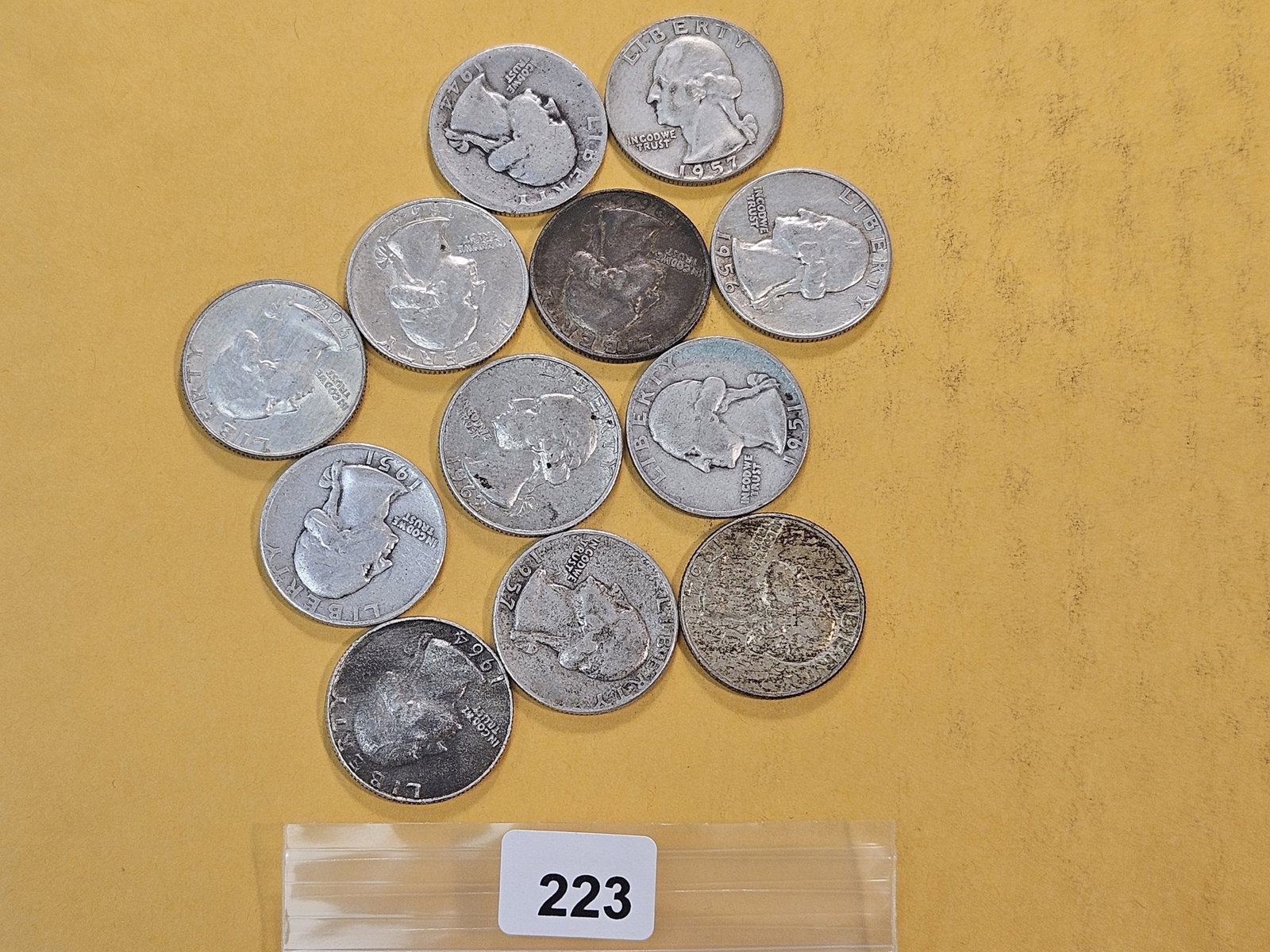 Twelve Washington Silver Quarters: Assorted dates and grades