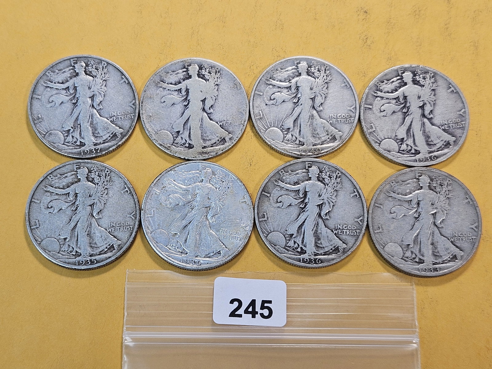 Eight Walking Liberty Silver Half Dollars: Assorted Dates and Grades