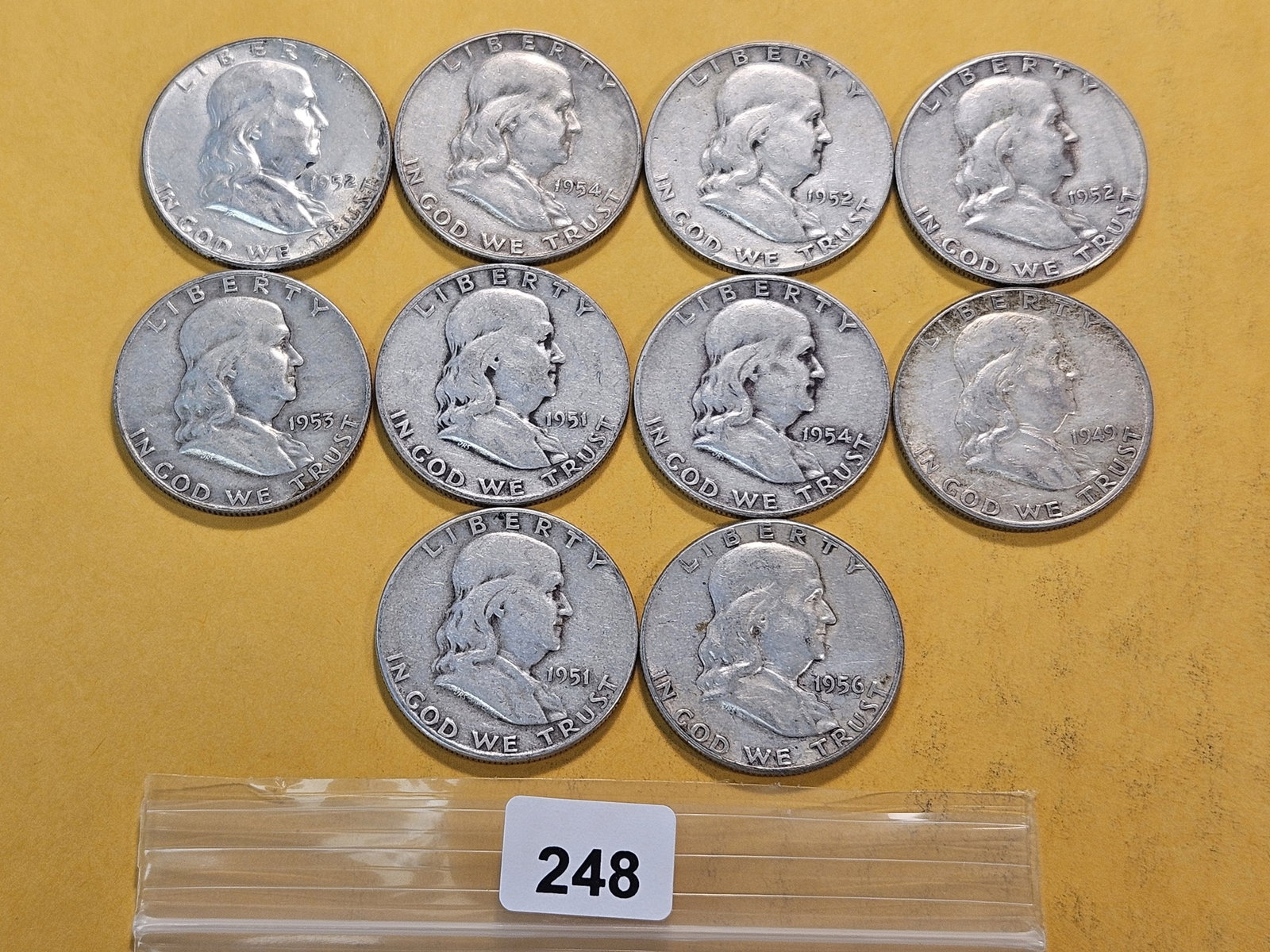 Ten Circulated Franklin Silver Half Dollars: Assorted Dates and Grades