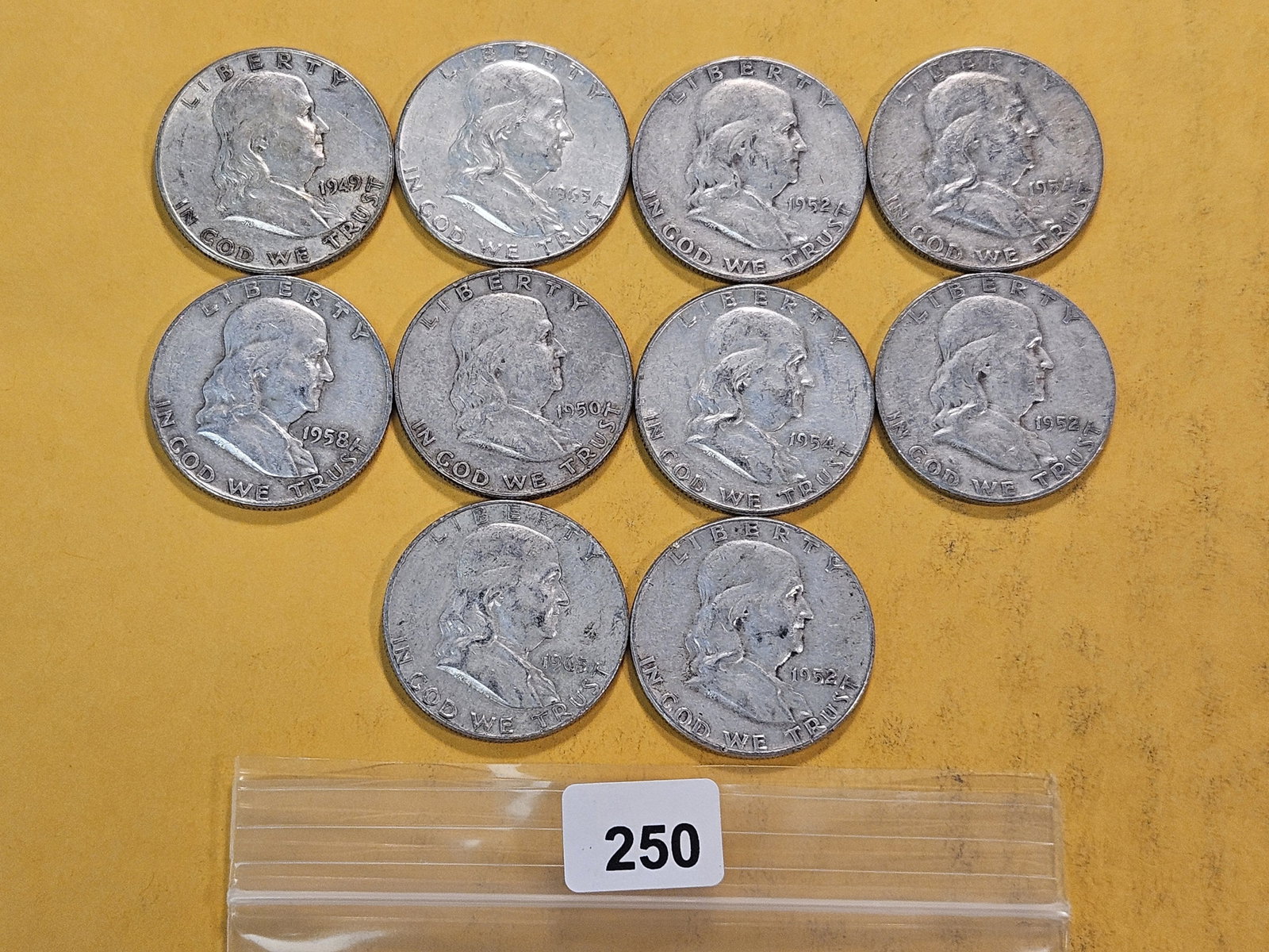 Ten Circulated Franklin Silver Half Dollars: Assorted Dates and Grades