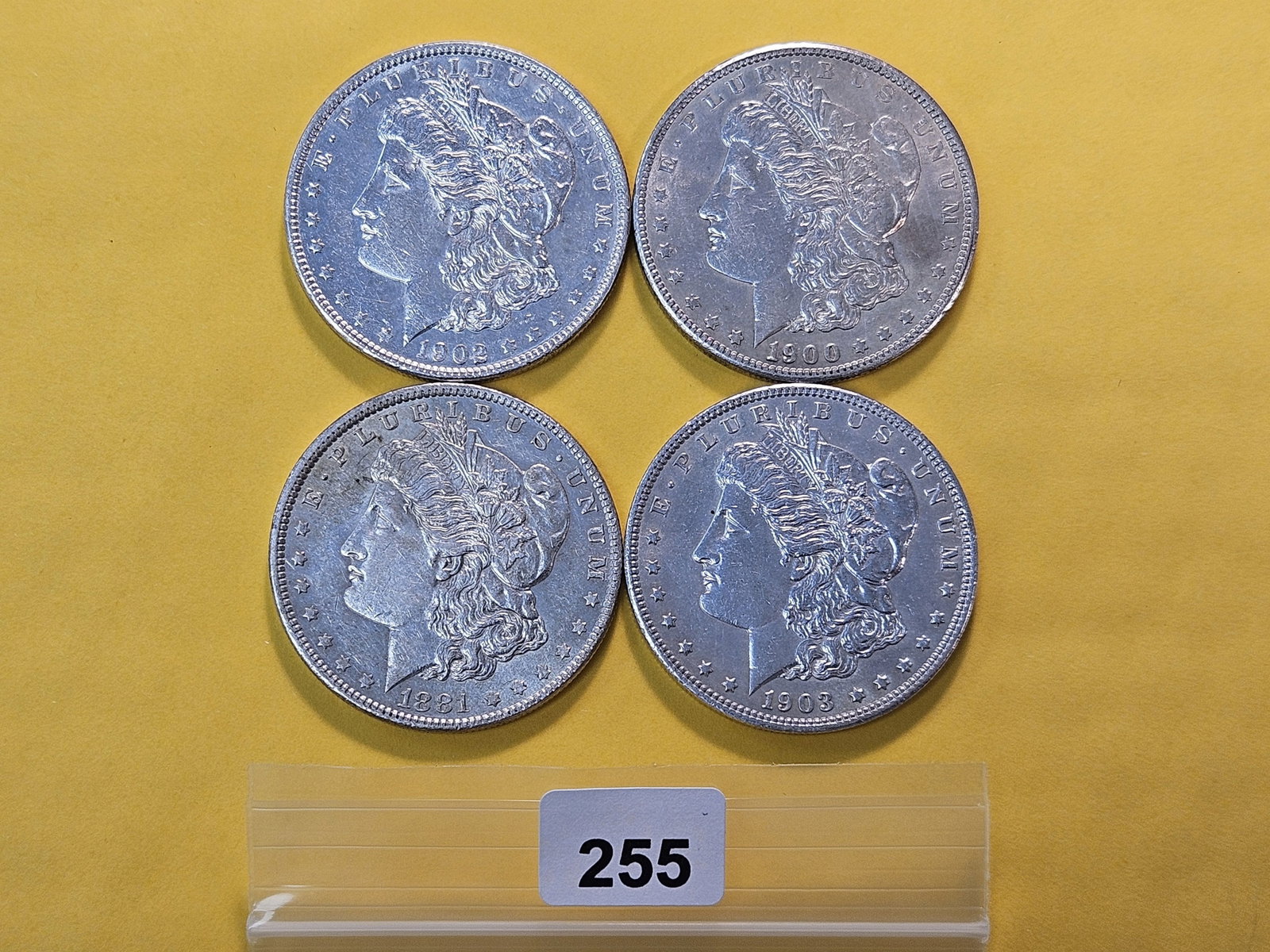 Four About Uncirculated Morgan Silver Dollars: 1881-O, 1900, 1902 and 1903