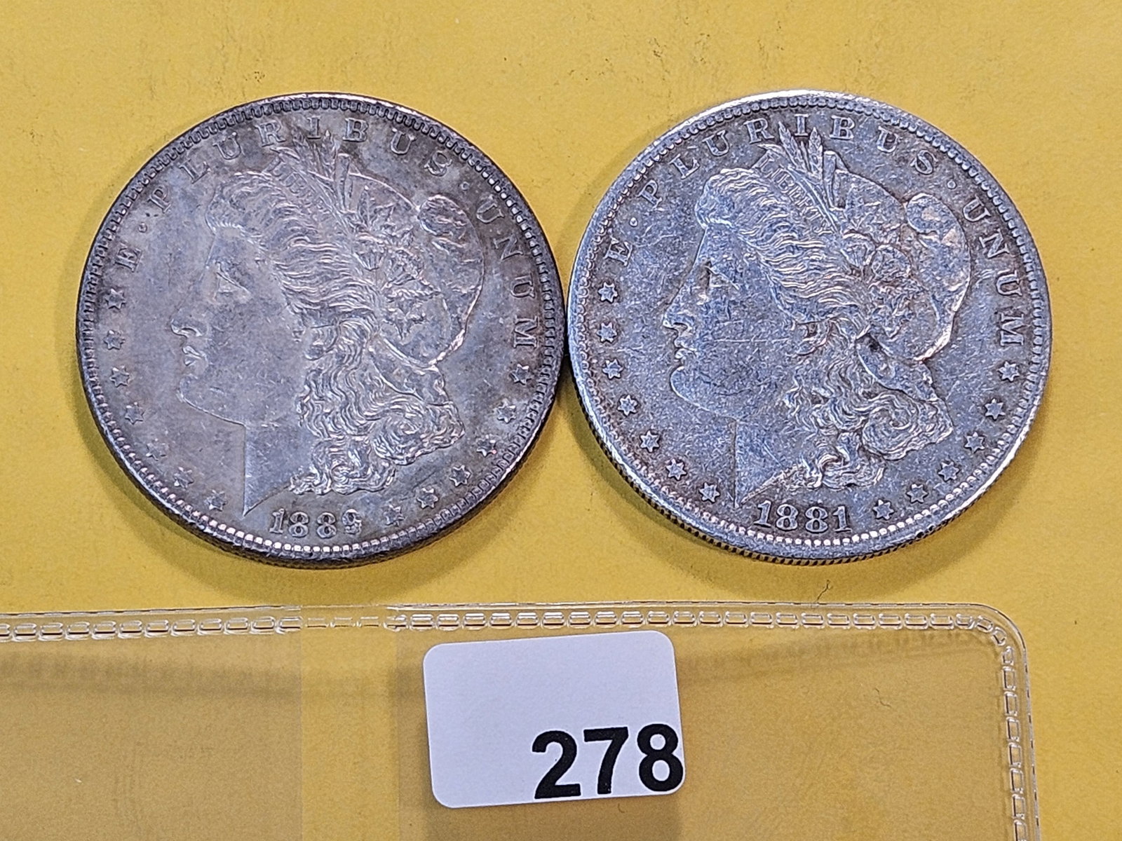 Two About Uncirculated Morgan Silver Dollars: 1881-S and 1889
