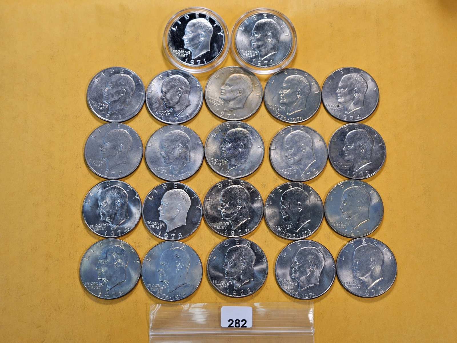 Twenty-two Eisenhower Dollars, two are Silver: Mixed dates, Proof and Business Strike Clads Ike's, with 1971-S GEM Proof and 1971-S Brilliant Uncirculated