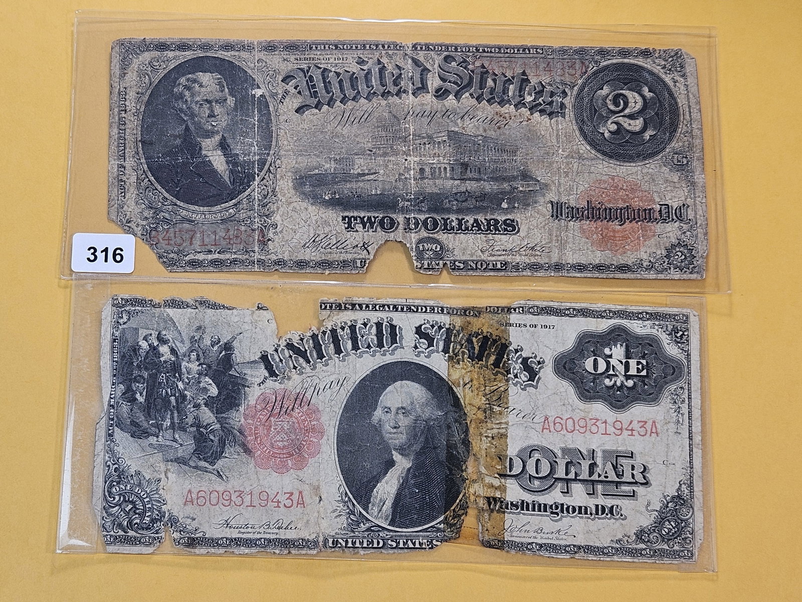 Two Series 1917 Obsolete United States Notes: One Dollar and Two Dollar Notes. Red Seals