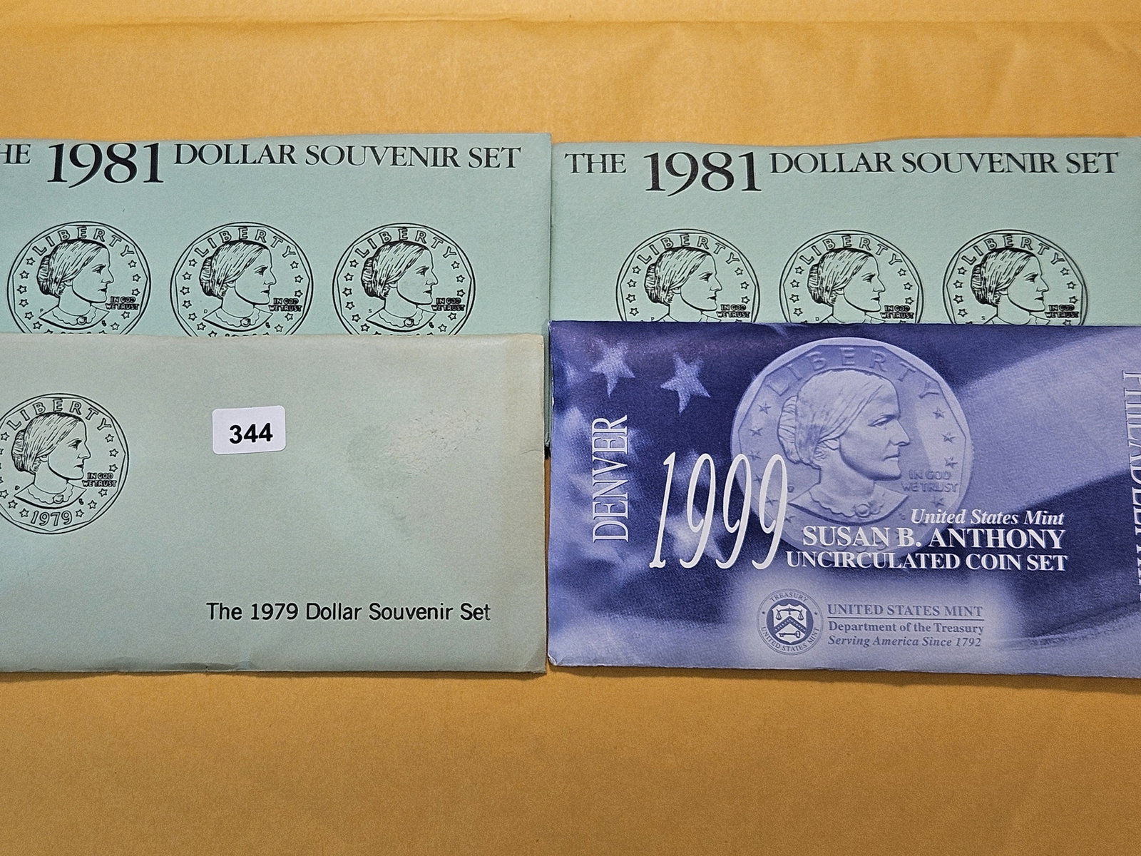 Four US Mint Uncirculated Coin Sets: 1979, two 1981 and a 1999. In Blister Pack and Envelope