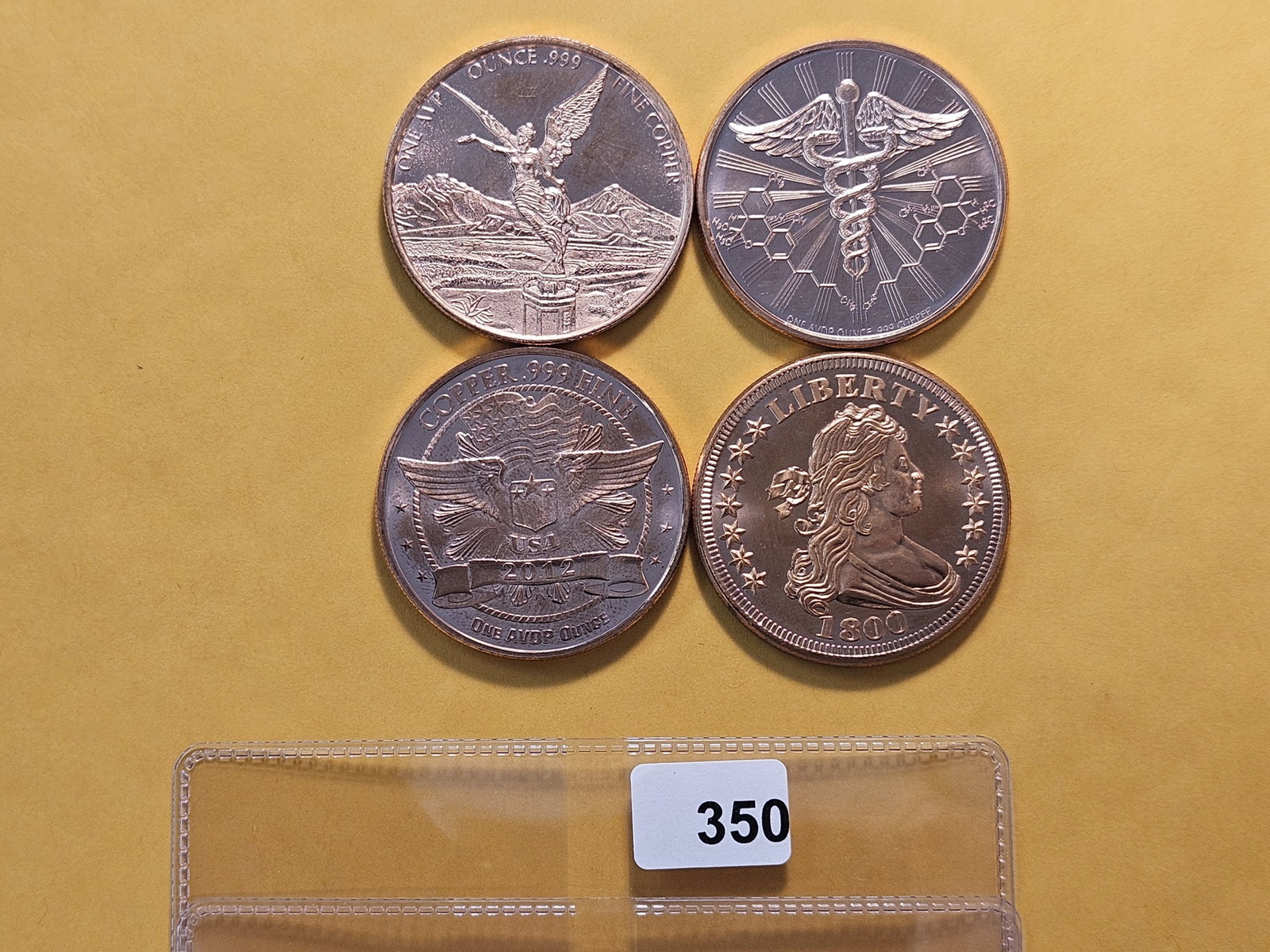 Four 1 Ounce .999 Fine Copper Art Rounds: Onza and Flowing Hair Dollar designs, with a Panda and medicine themed rounds