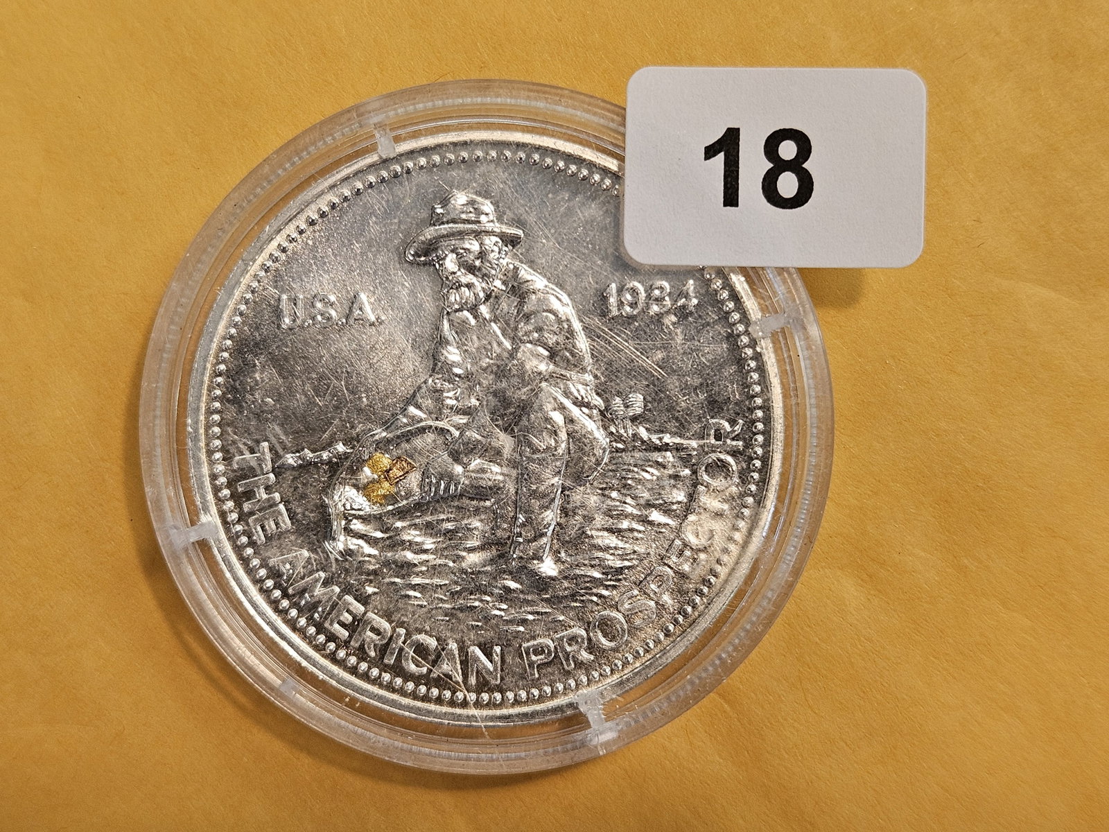 GOLD and SILVER! Gold Nugget in a silver round: Englehard One Troy ounce .999 fine silver Prospector round with gold nuggets embedded into the coin