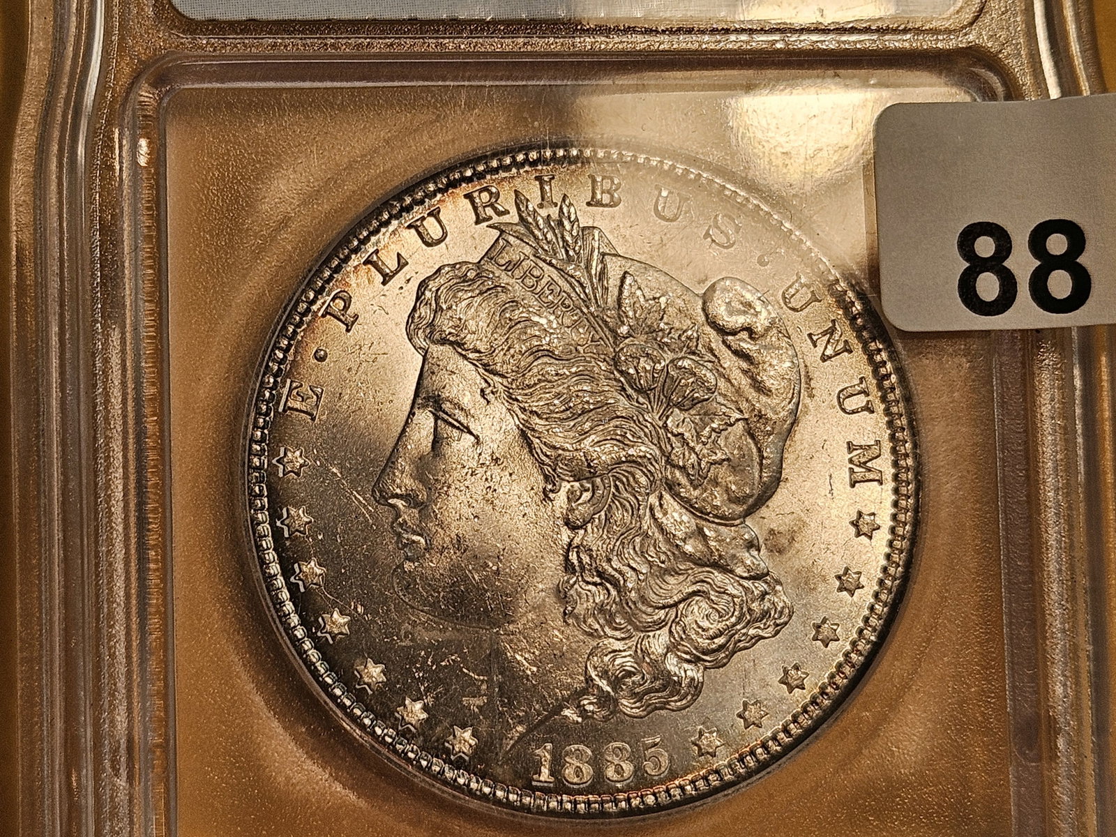 ** KEY DATE ** ICG 1885-CC Morgan Dollar in Mint State 64 - 7