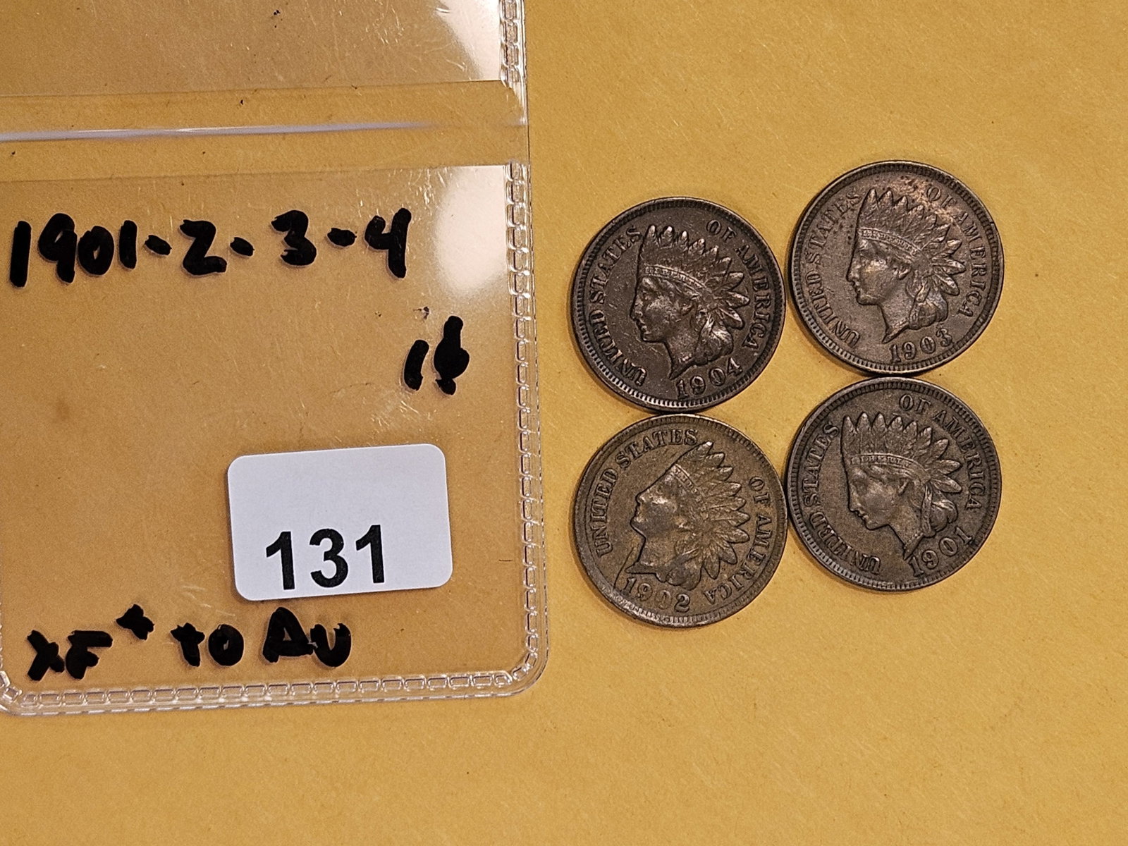 Four Indian Cents in Extra fine to About Uncirculated - 2