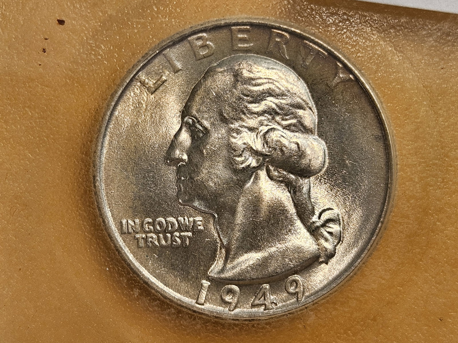 GEM Brilliant Uncirculated 1949 Washington Quarter: Graded by an off-brand company in MS-66. I'd say it's not too far off