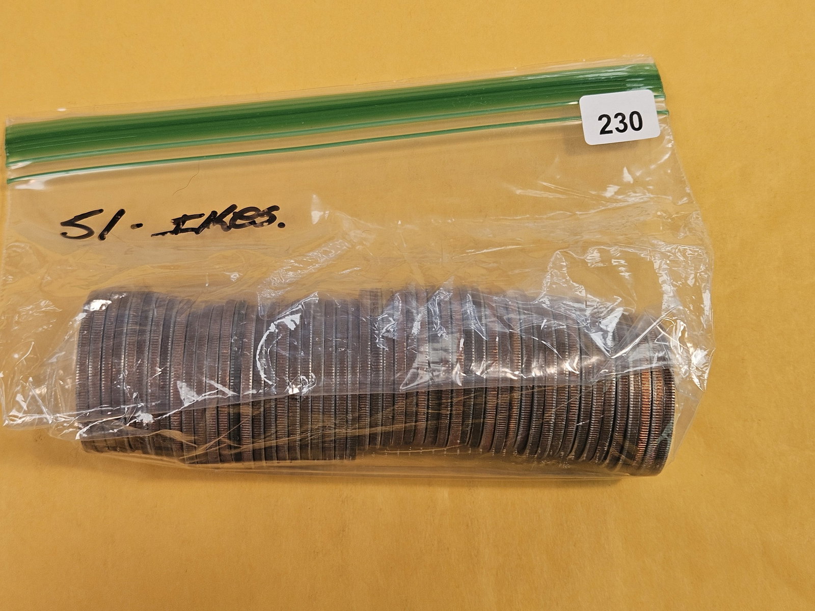 Fifty-One Eisenhower dollars: From dealer. Unchecked by us.