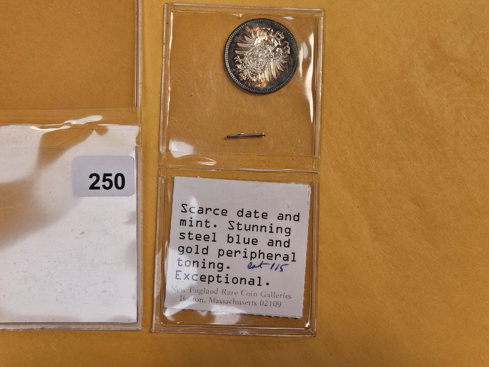 ** Superb GEM 1881-E Germany silver One Mark: KM 7. J-9. Dealer's Note: Scarce date and Mint. Stunning Steel Blue and gold peripheral toning! Exceptional!