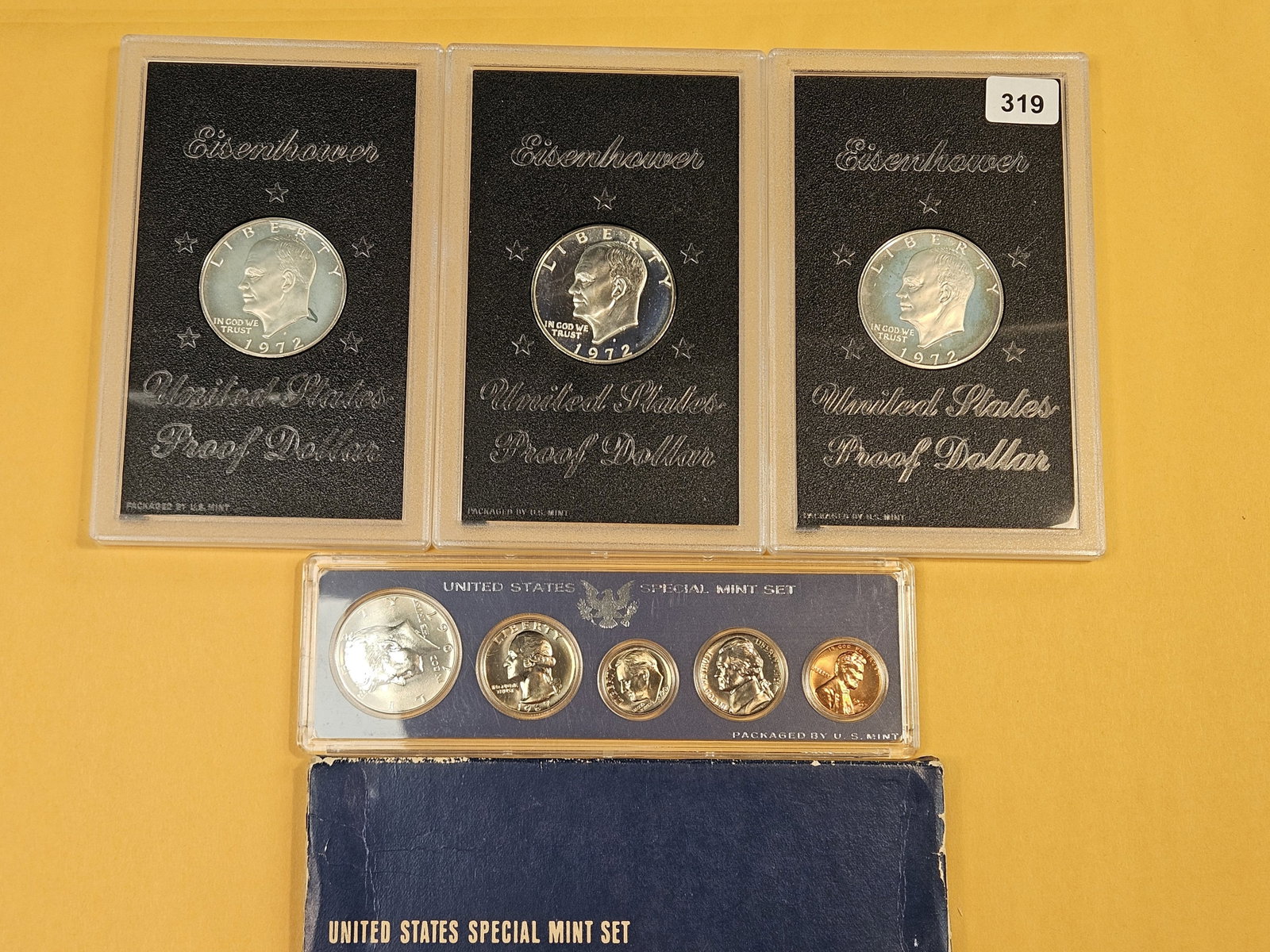 Three 1972-S Silver Eisenhower Dollars and a 1967 SM set: Proof Brown Ikes in GSA hardpacks. No outer boxes