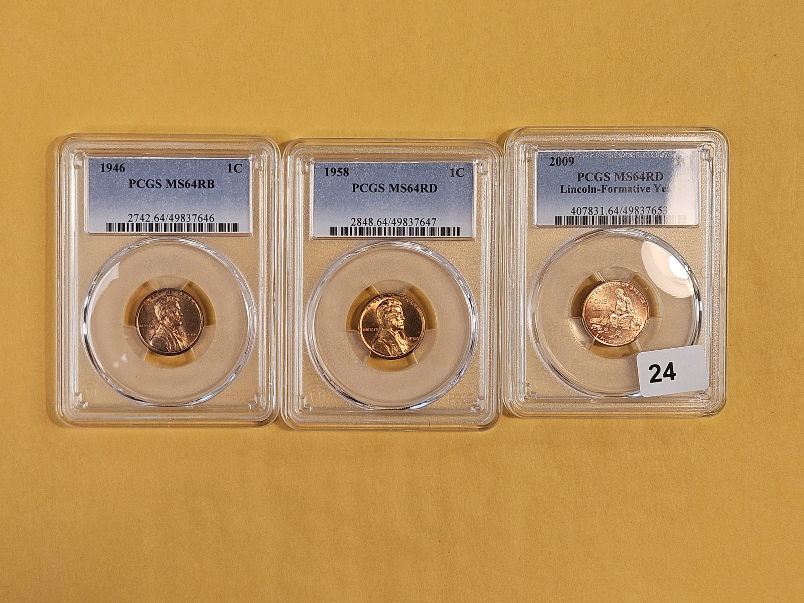 Three PCGS-graded Mint State 64 RED Lincoln cents: 1946, 1958 and 2009