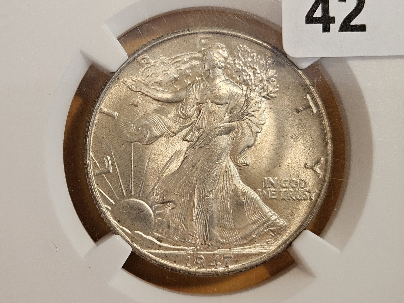NGC 1947 Walking Liberty silver Half Dollar in Mint State 64: Lite patina