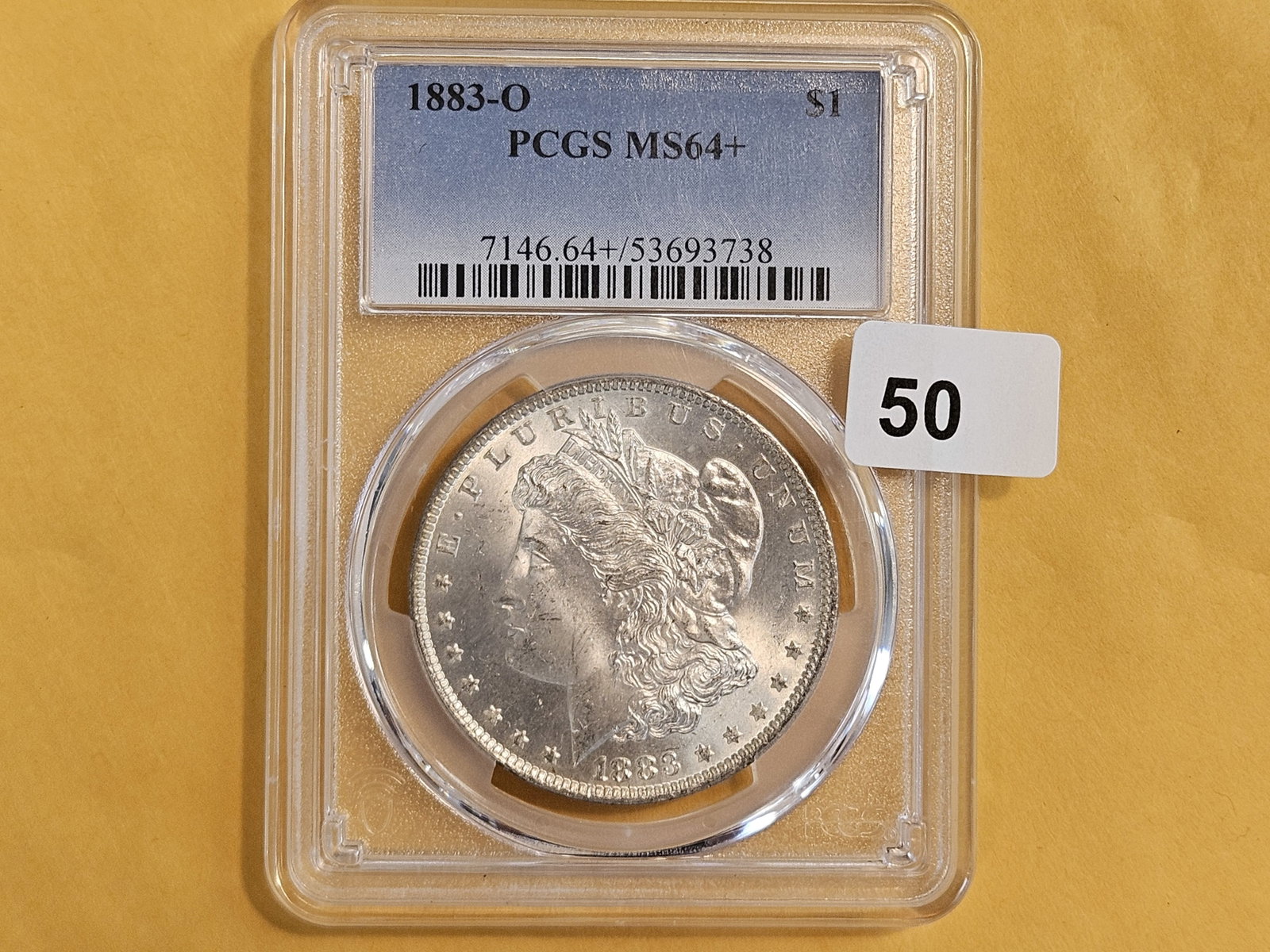 PCGS 1883-O Morgan Dollar in Mint State 64 PLUS: Purt near GEM!