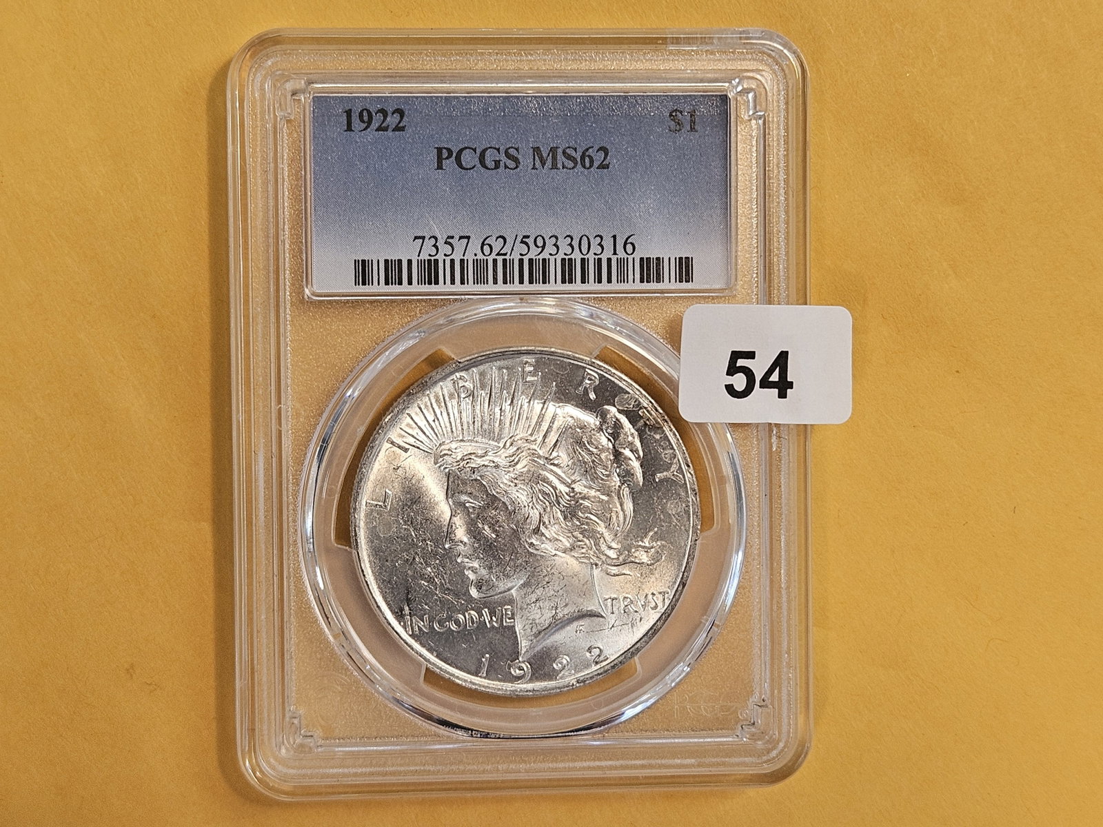 PCGS 1922 Peace Silver Dollar in Mint State 62: Good luster