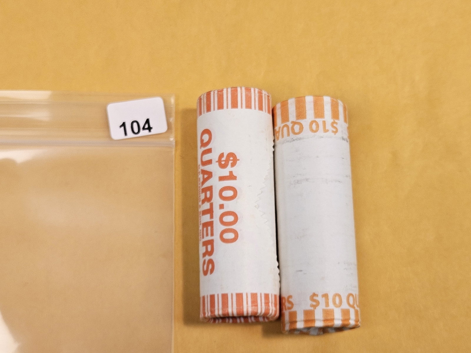 Two GEM Brilliant Uncirculated MINT-Wrapped Quarter Rolls: Ends are toned. Unopened by us