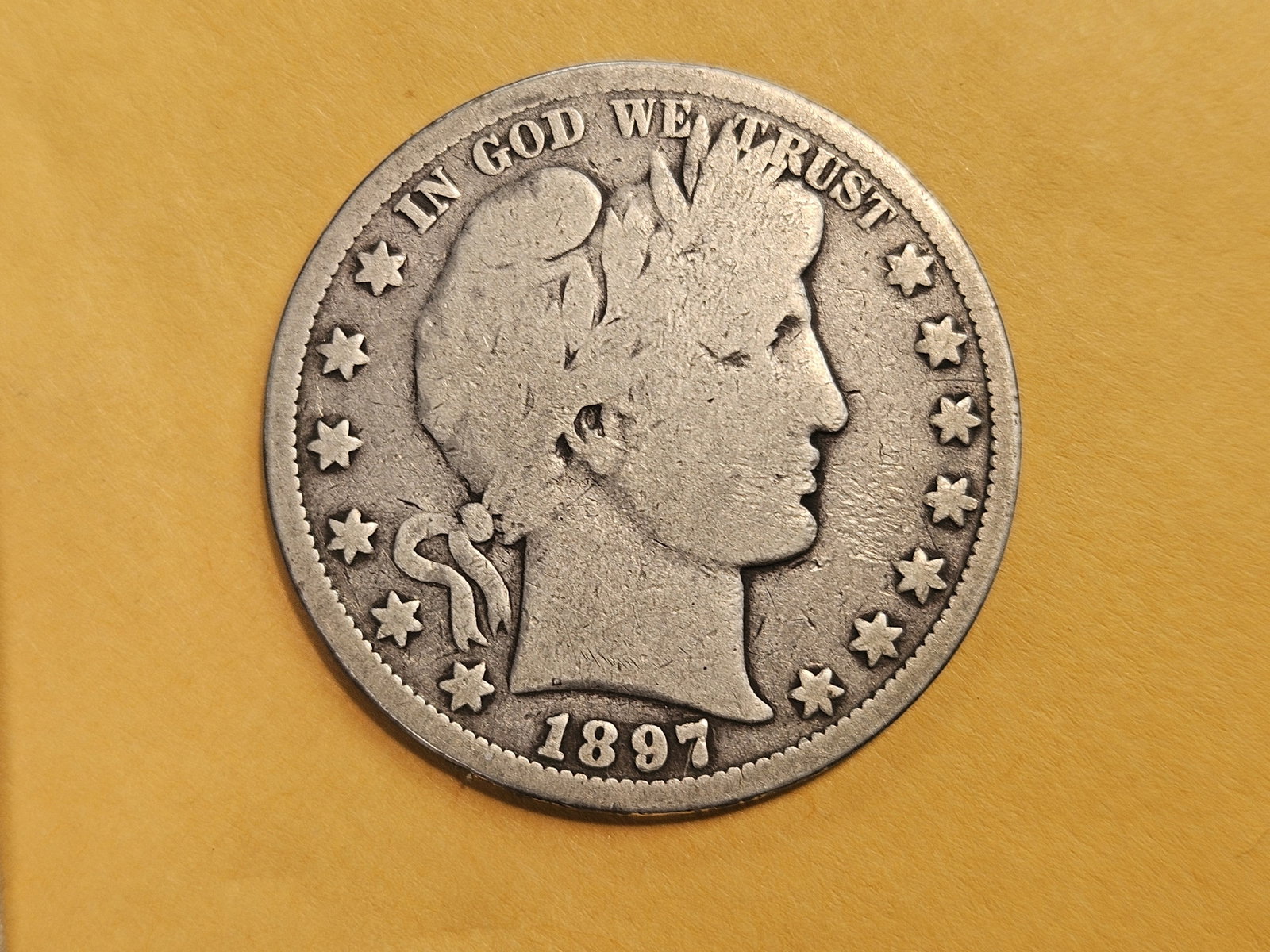 KEY DATE! 1897-O Barber Half Dollar in Good: Obverse has full rims