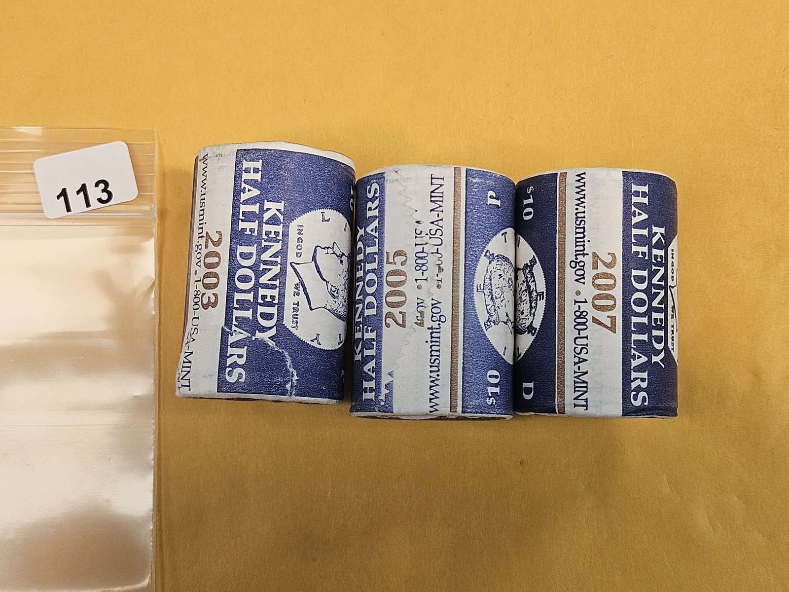 Three Mint-Wrapped, GEM Brilliant Uncirculated Kennedy Half Dollars: From consignor. Unopened by us
