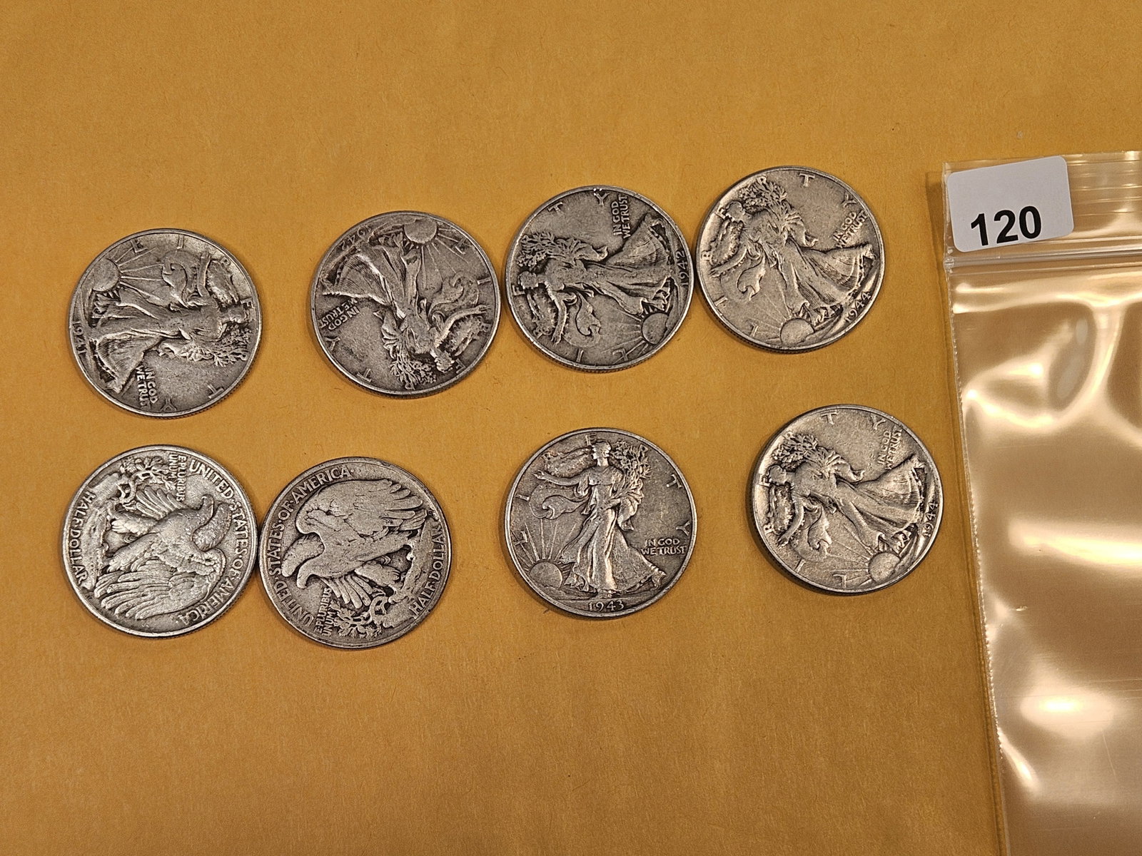 Eight mixed silver Walking Liberty Half Dollars: Circulated