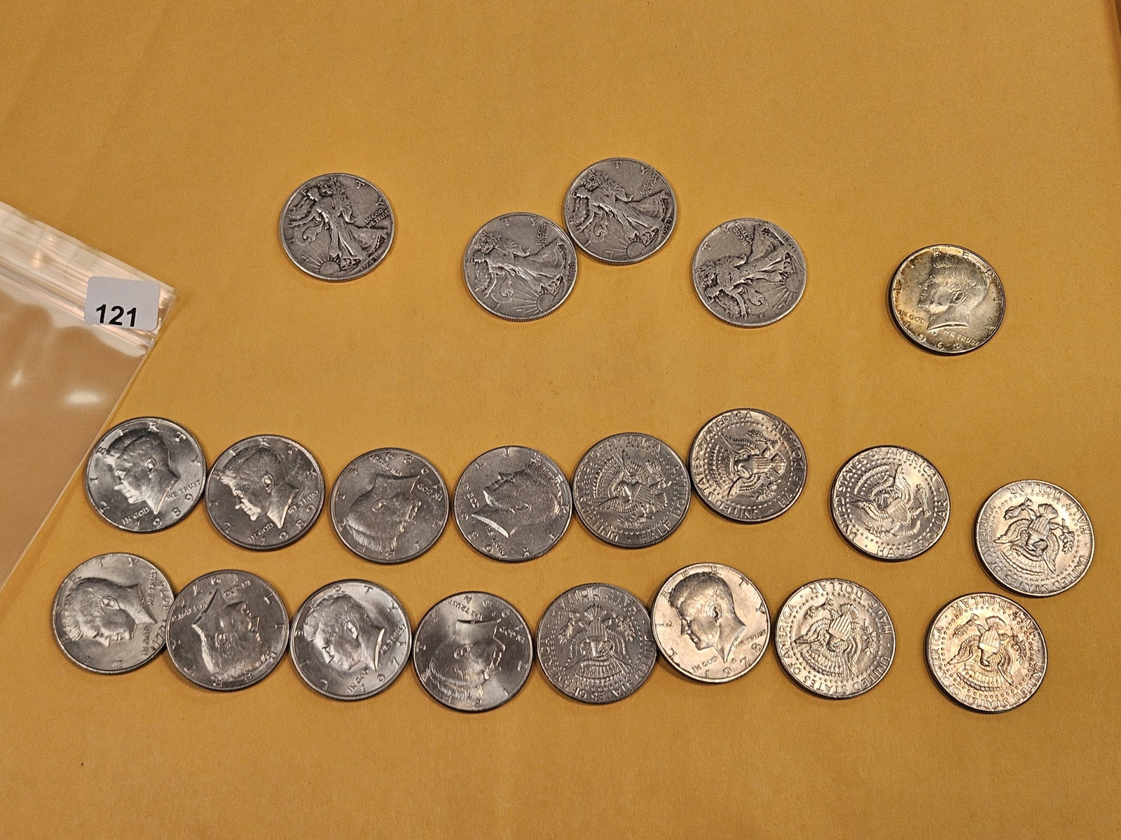Twenty-one mixed half dollars - 2