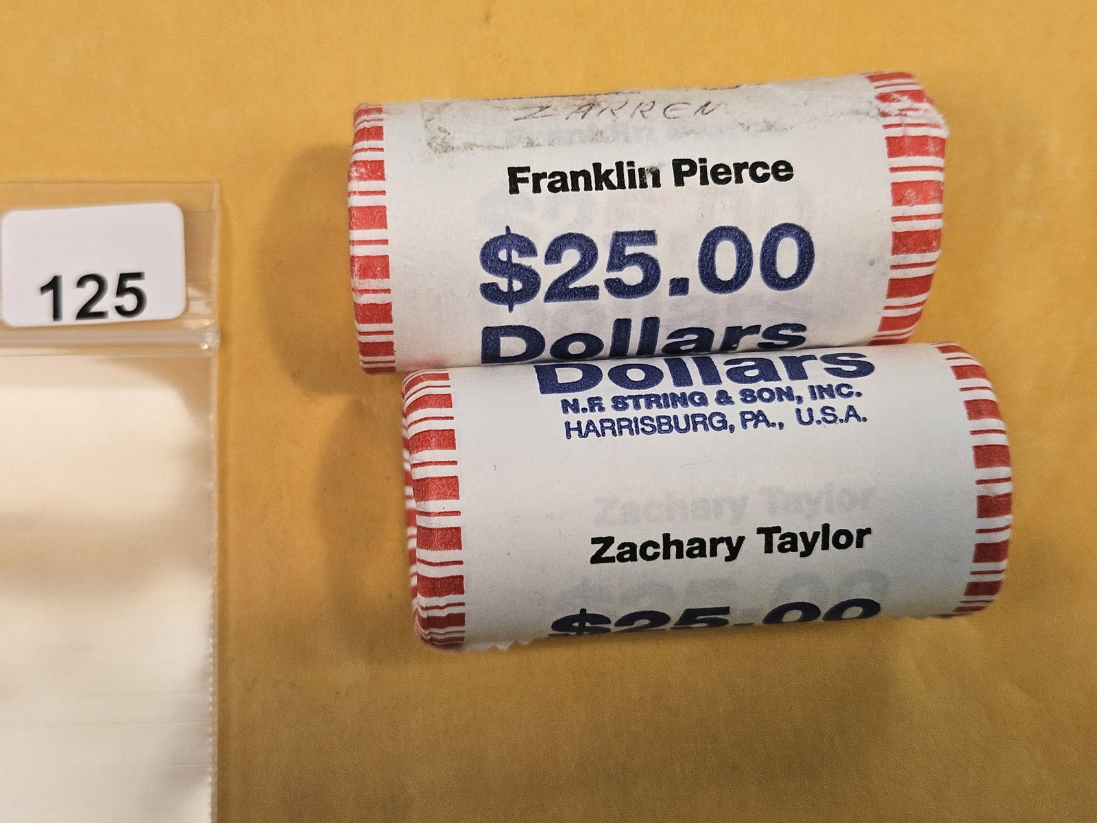 Two Mint-Wrapped, GEM Brilliant Uncirculated Presidential Dollar Rolls: Pierce and Taylor