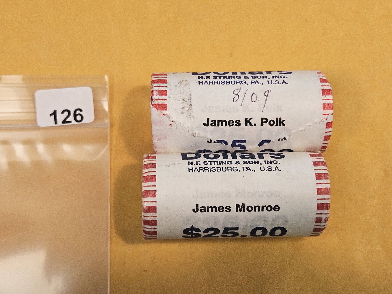 Two Mint-Wrapped, GEM Brilliant Uncirculated Presidential Dollar Rolls: Polk and Monroe