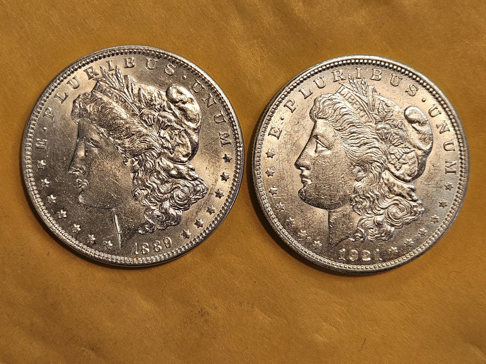 Two Brilliant About Uncirculated plus Morgan Dollars: Mixed
