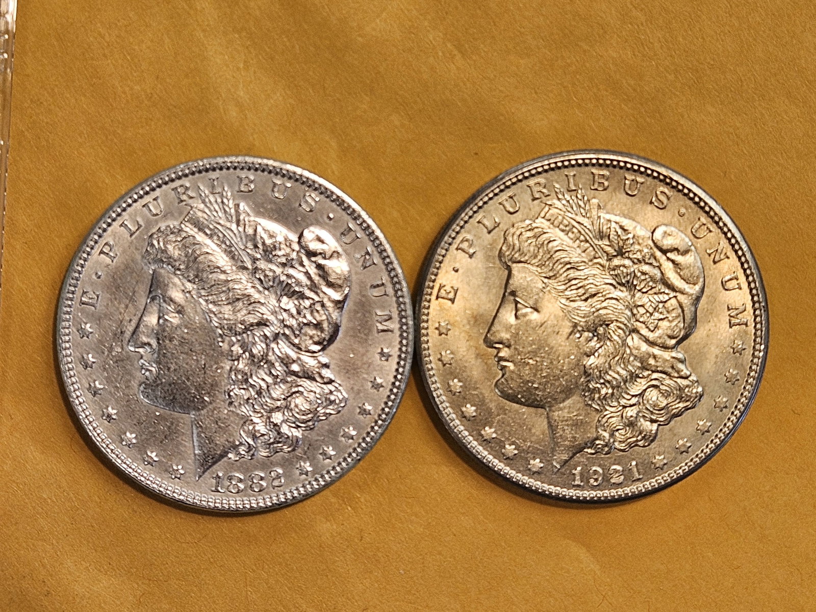 Two Brilliant About Uncirculated plus Morgan Dollars: Mixed