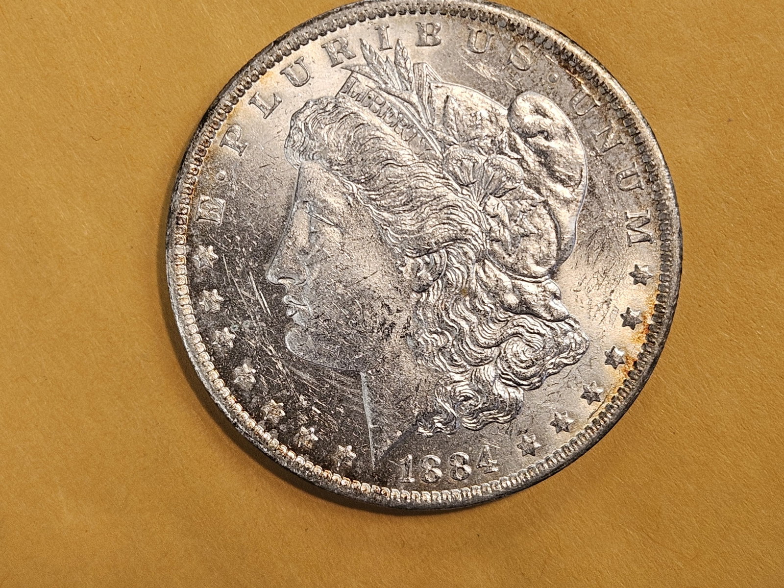 Brilliant UncirculatedPlus 1881-O Morgan Dollar: Light patina