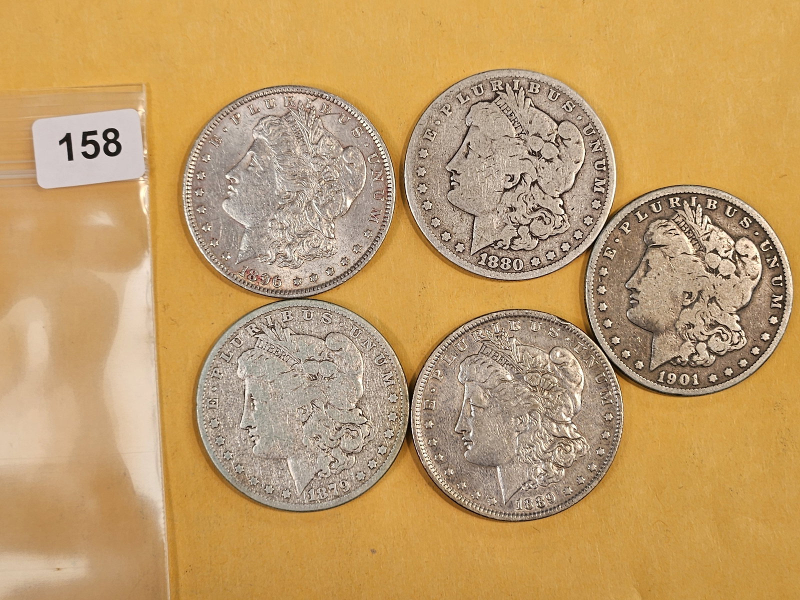 Five Morgan Silver Dollars (1 of 2)