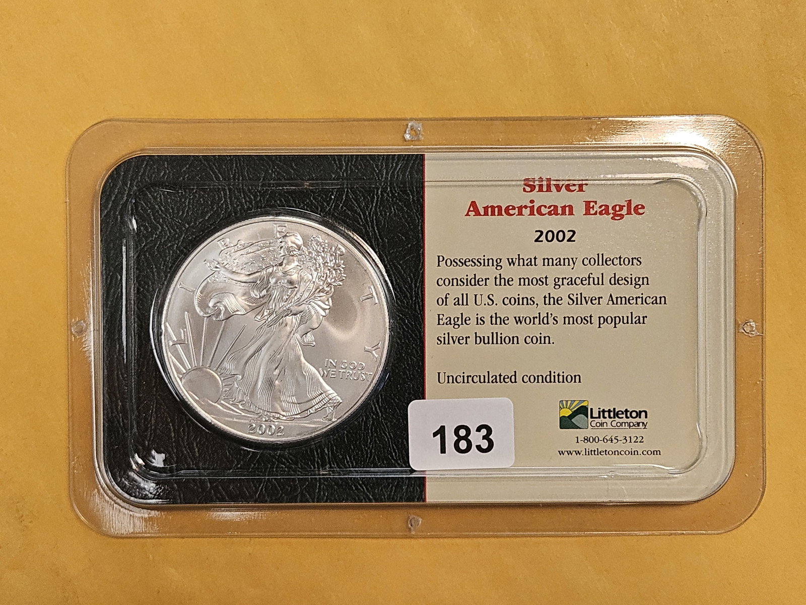 GEM Brilliant Uncirculated 2002 American Silver Eagle: In Littleton plastic holder.