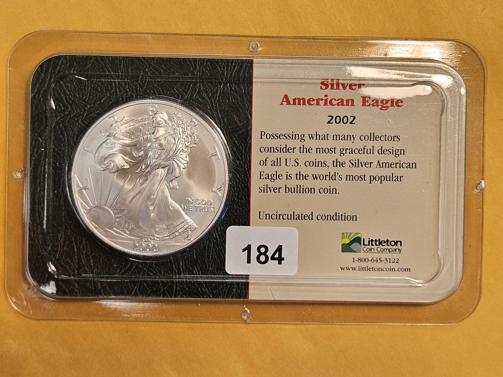 GEM Brilliant Uncirculated 2002 American Silver Eagle: In Littleton plastic holder.
