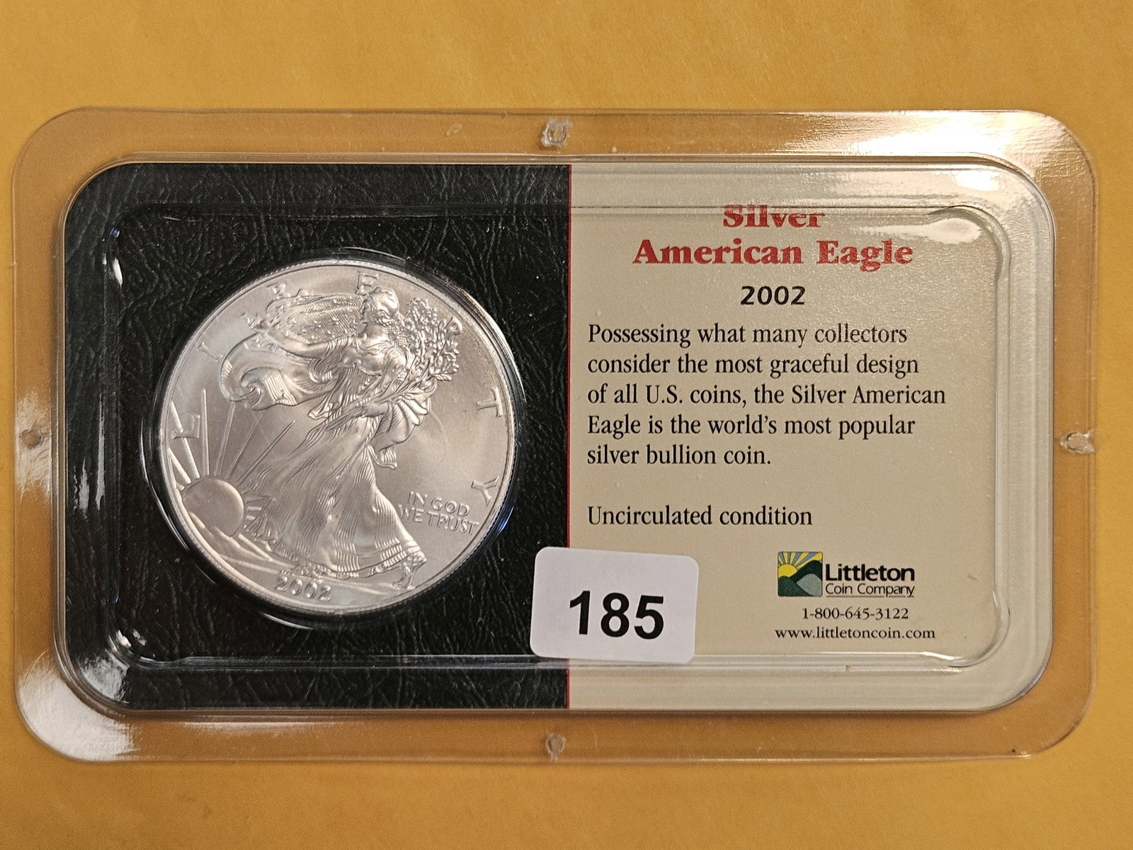 GEM Brilliant Uncirculated 2002 American Silver Eagle: In Littleton plastic holder.