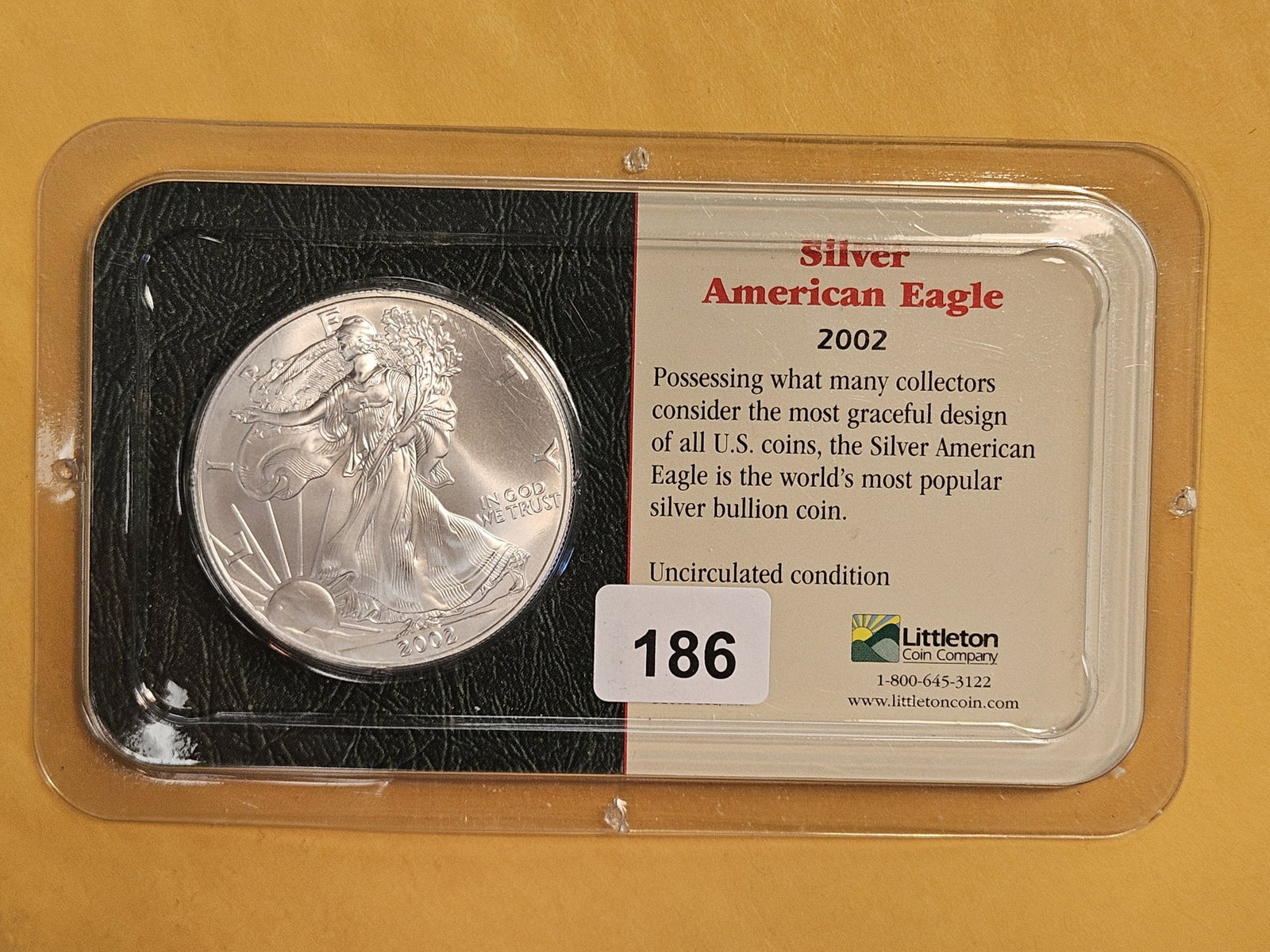 GEM Brilliant Uncirculated 2002 American Silver Eagle: In Littleton plastic holder.