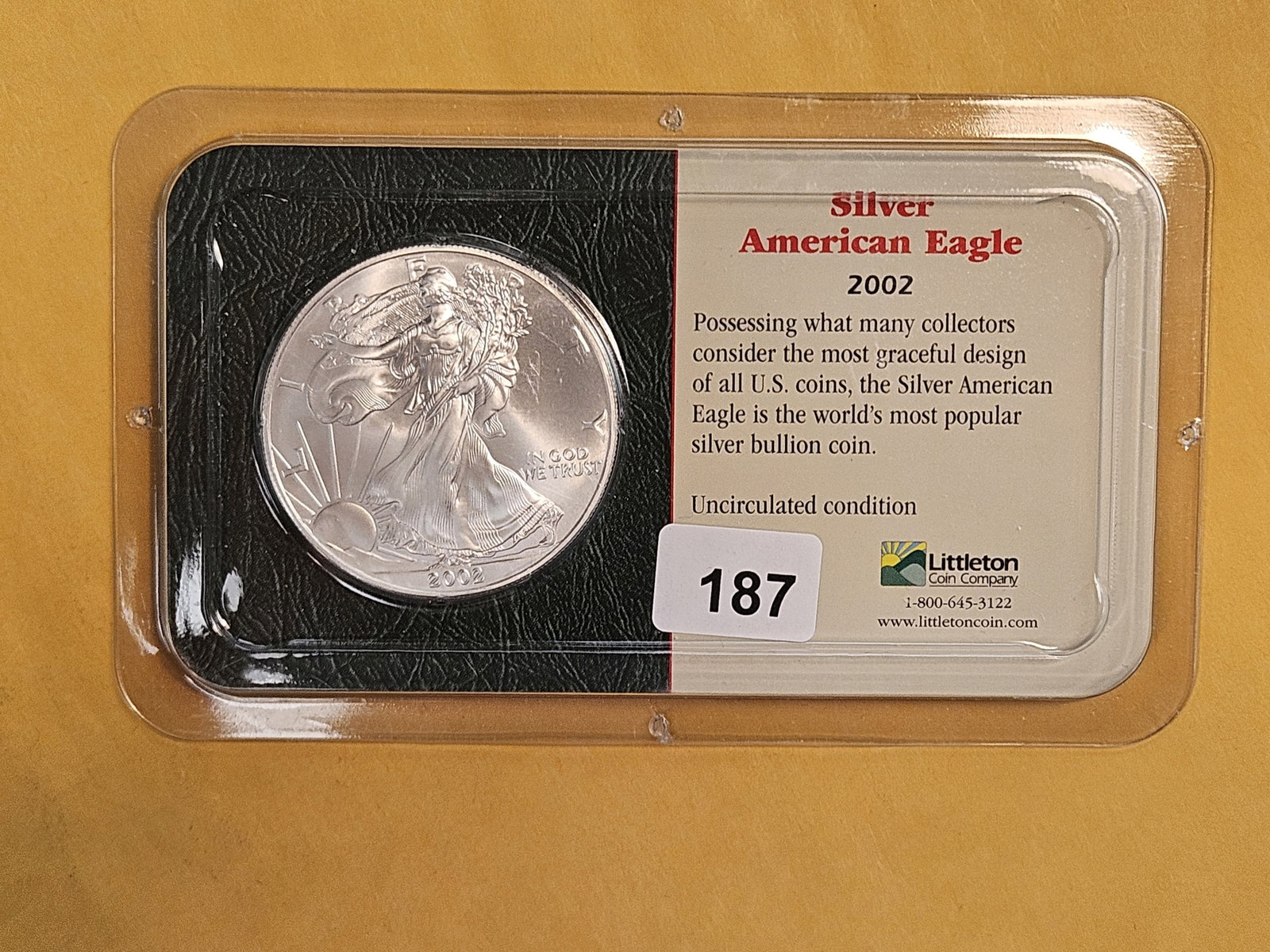 GEM Brilliant Uncirculated 2002 American Silver Eagle: In Littleton plastic holder.