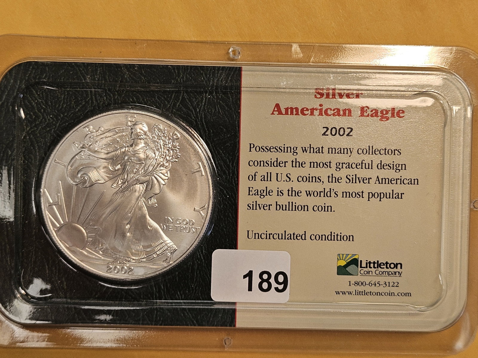 GEM Brilliant Uncirculated 2002 American Silver Eagle: In Littleton plastic holder.