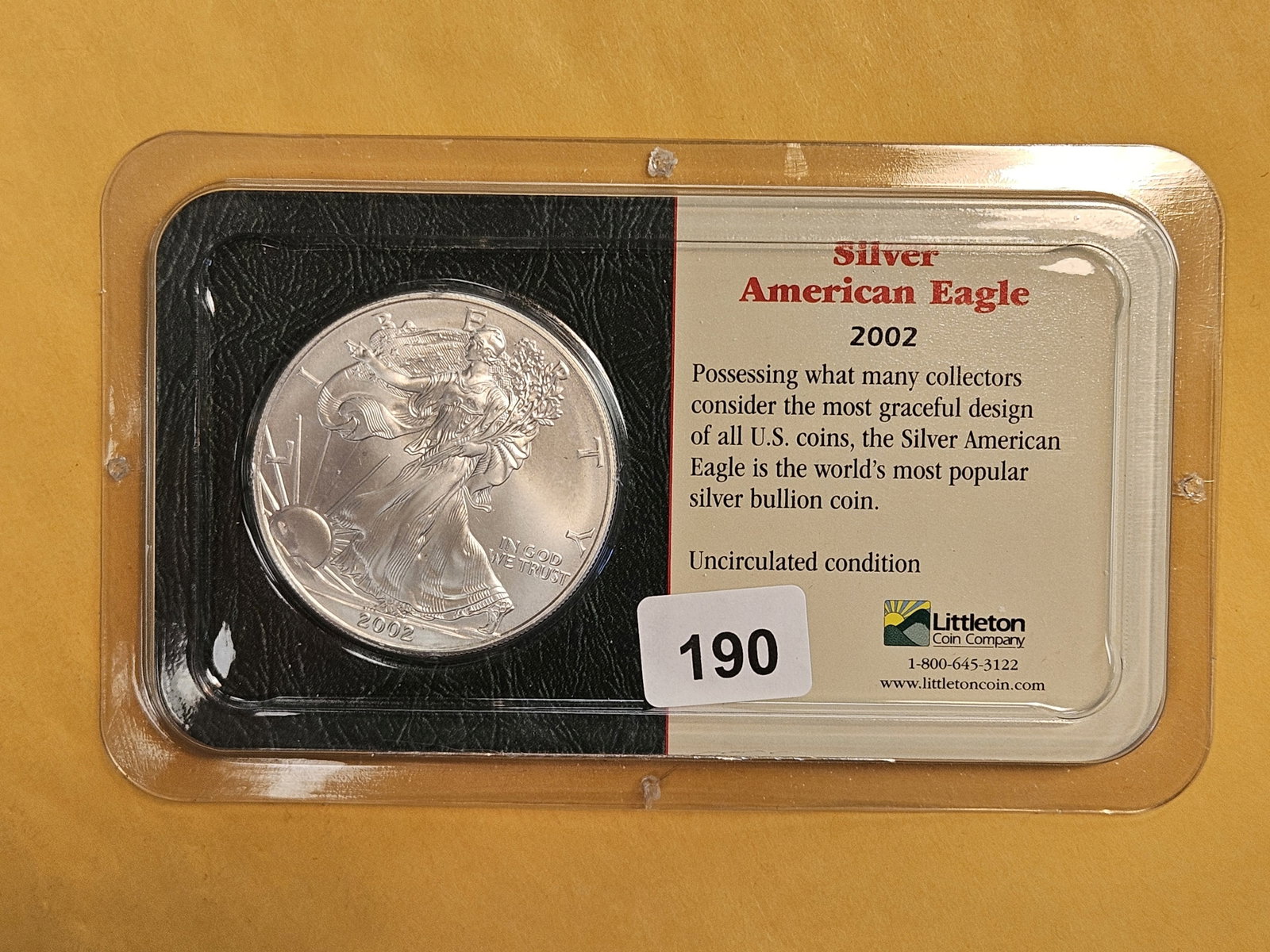 GEM Brilliant Uncirculated 2002 American Silver Eagle: In Littleton plastic holder.