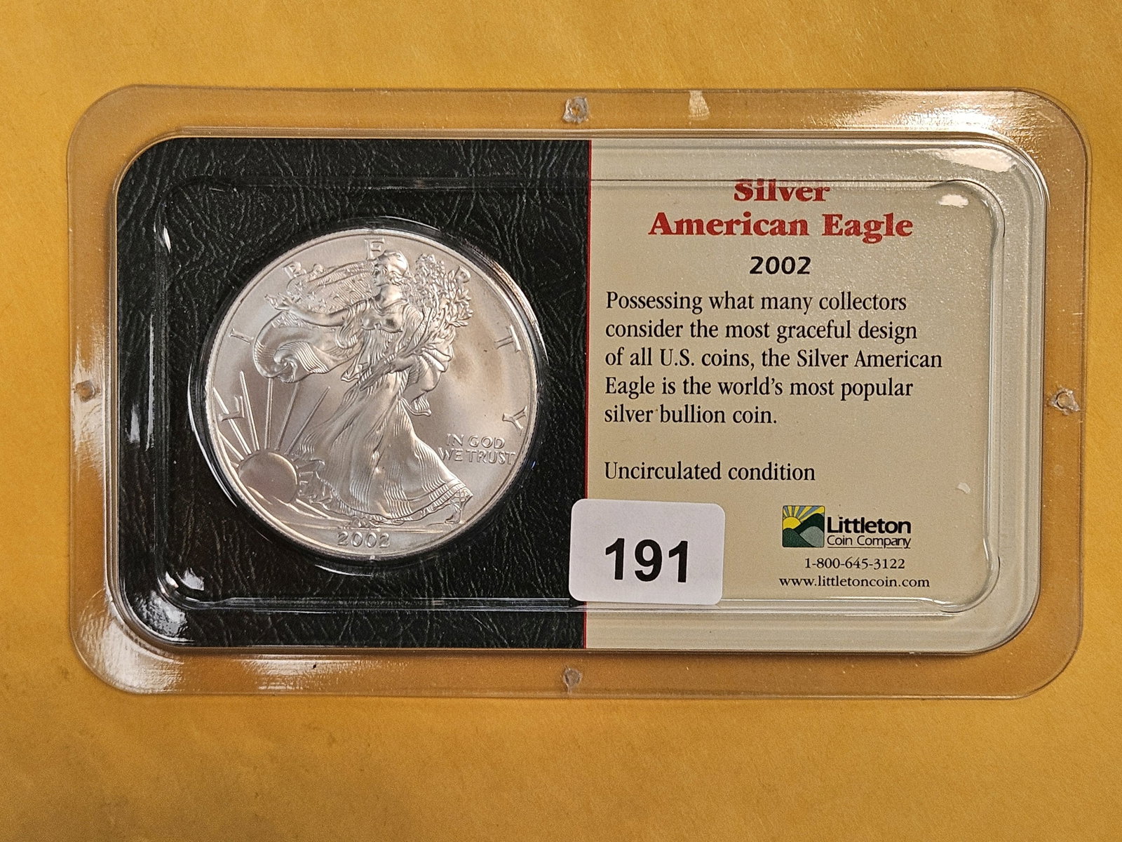 GEM Brilliant Uncirculated 2002 American Silver Eagle: In Littleton plastic holder.