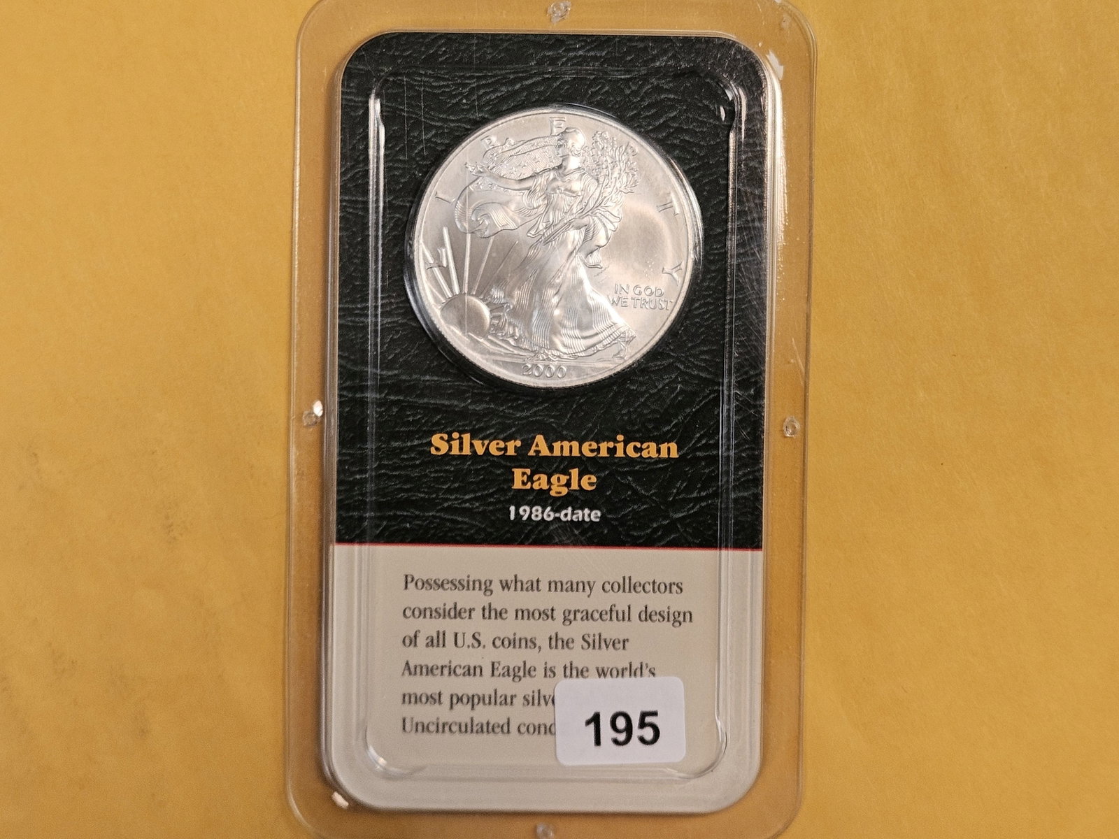 GEM Brilliant Uncirculated 2000 American Silver Eagle: In Littleton plastic holder.