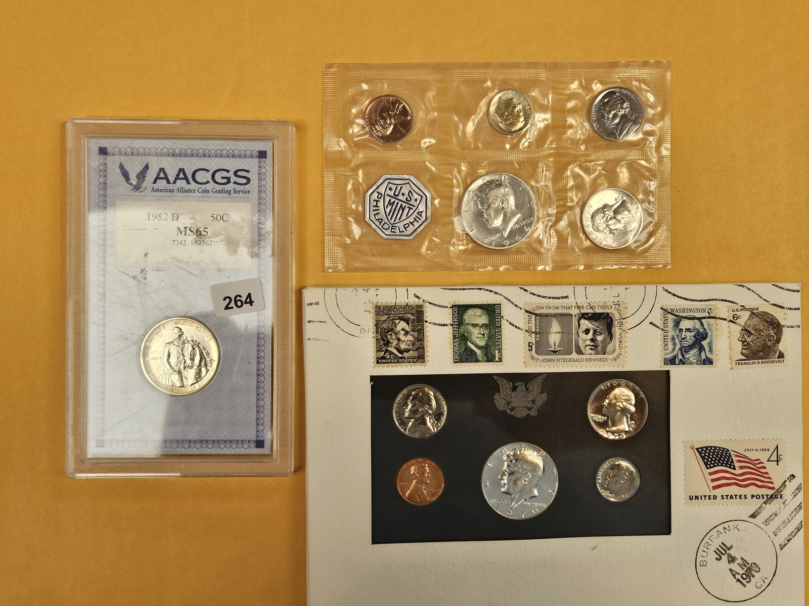Three sets with silver coins: Commemorative silver half, 1964 Silver Proof set in blister pack and silver 1970 (40% silver) proof set in USPS package